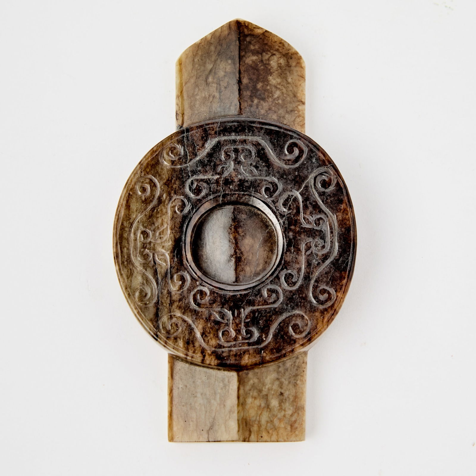 A Chinese Archaistic Mottled Jade Ceremonial Blade and Disc, Bi Ming-Qing Dynasty: Carved as a blade inset with a circular bi, the latter carved in low relief with archaistic motifs surrounding the central aperture. (Length 4 7/8 inches) E.J. Frankel Collection; per label.