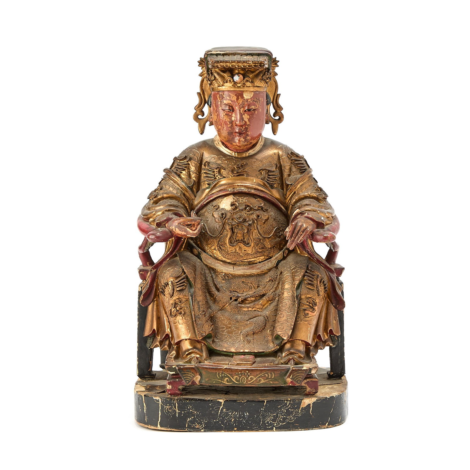 A Chinese Gilt Lacquered Wood Figure of a Daoist Deity Qing Dynasty: The seated female figure dressed in a long, voluminous robe decorated with dragons, clouds, and other auspicious and authoritative emblems, the face with a serene expression. (Height 11 1/2 inches)