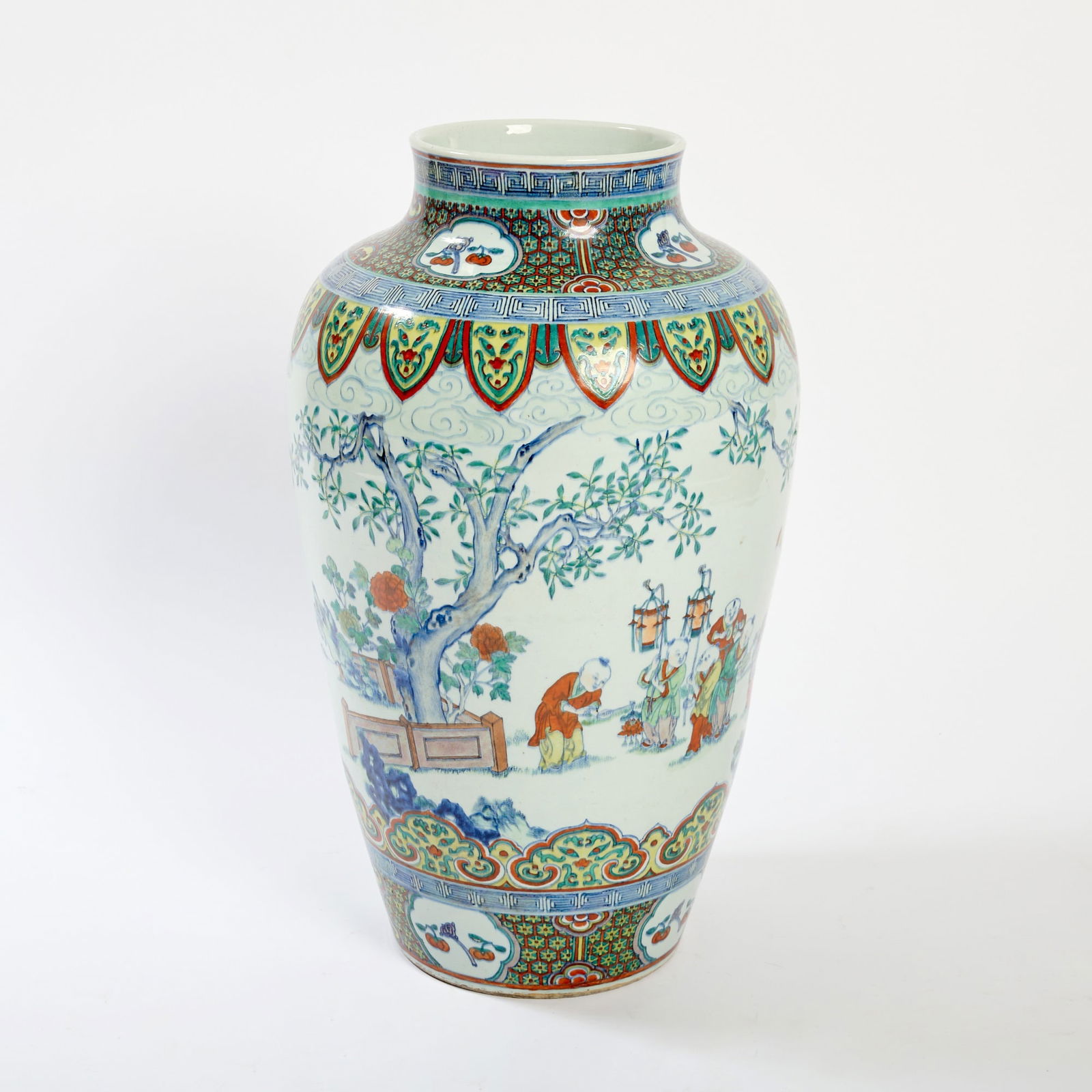A Large Chinese Doucai Porcelain Vase 19th-20th century: Of tapering form with a short neck; decorated with boys at play in a garden setting, all between decorative bands. (Height 30 1/2 inches)