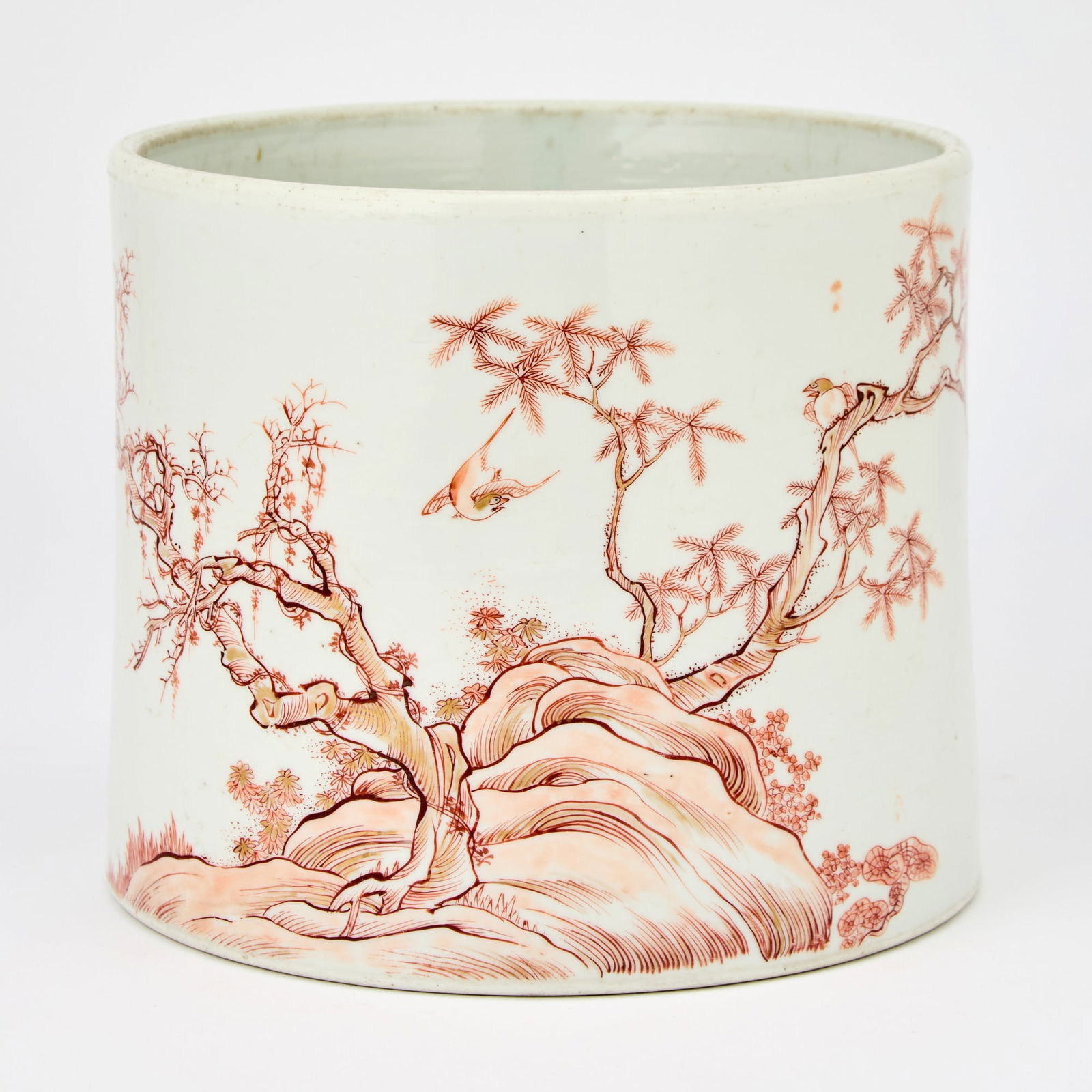 A Rare Chinese Iron Red and Gilt Decorated Porcelain 'Magpies' Brush Pot, Bitong Chenghua: Of cylindrical form tapering slightly toward mouth; decorated in iron red and with gilt highlights to show a flock of magpies within a sparse landscape featuring gnarled trees, flowers, lingzhi and ro