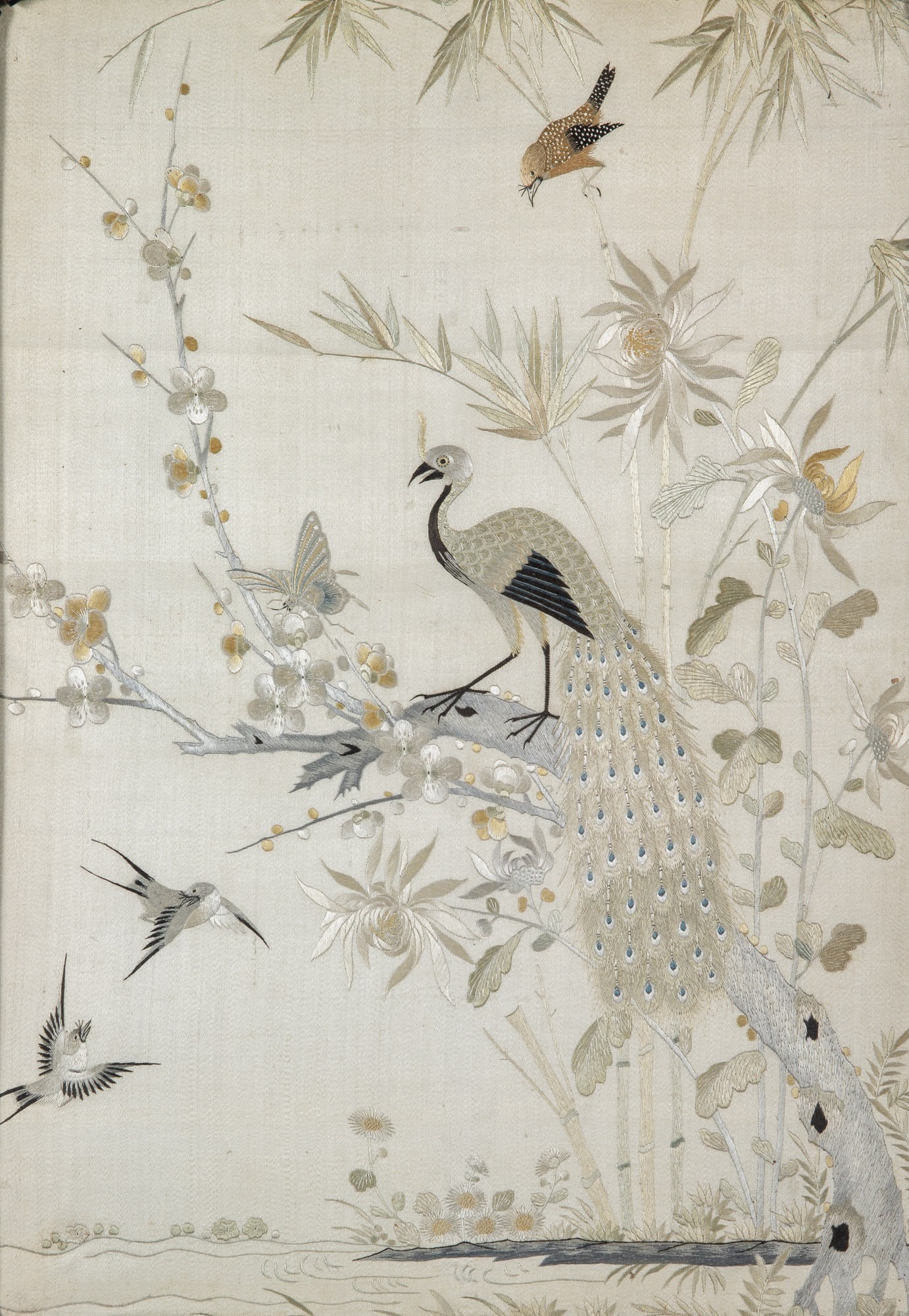 A Chinese Silk Embroidery Panel with a Hardwood Frame Qing Dynasty: Decorated with birds perched on blossoming branches; the frame embellished in mother-of-pearl with ‘fu’ bats and ‘shou’ characters. (Sight 13 x 19 inches)
