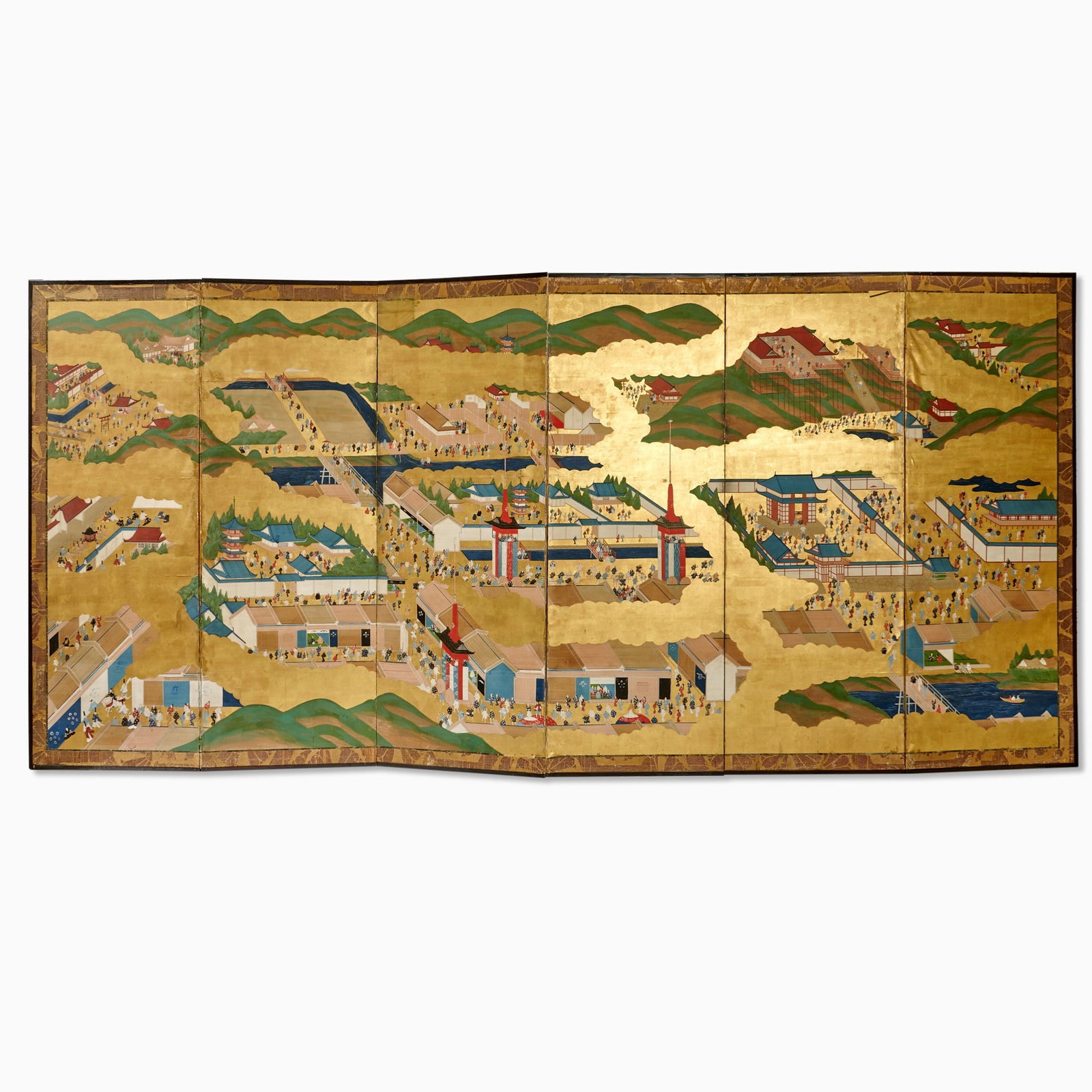 A Japanese Kano School Six-Fold Screen Edo Period, 19th century: Ink, colors, and gold leaf on paper; depicting a cityscape with figures during a festival. (145 inches × 67 1/2 inches)