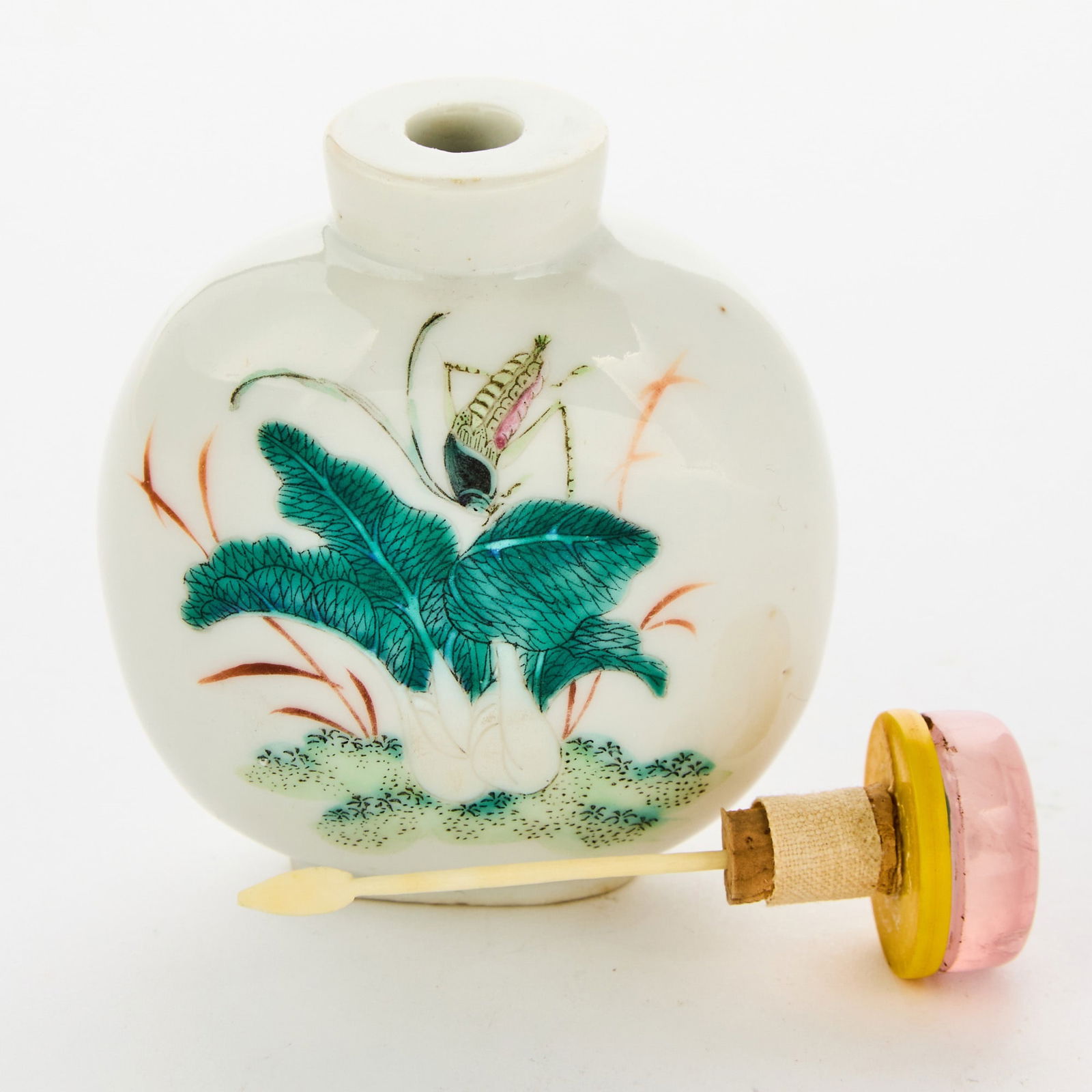 A Chinese Famille Rose Porcelain Snuff Bottle 18th Century: Of compressed bulbous form; decorated with crickets, cabbage and flowers. (Height 3 inches) Overall good condition.