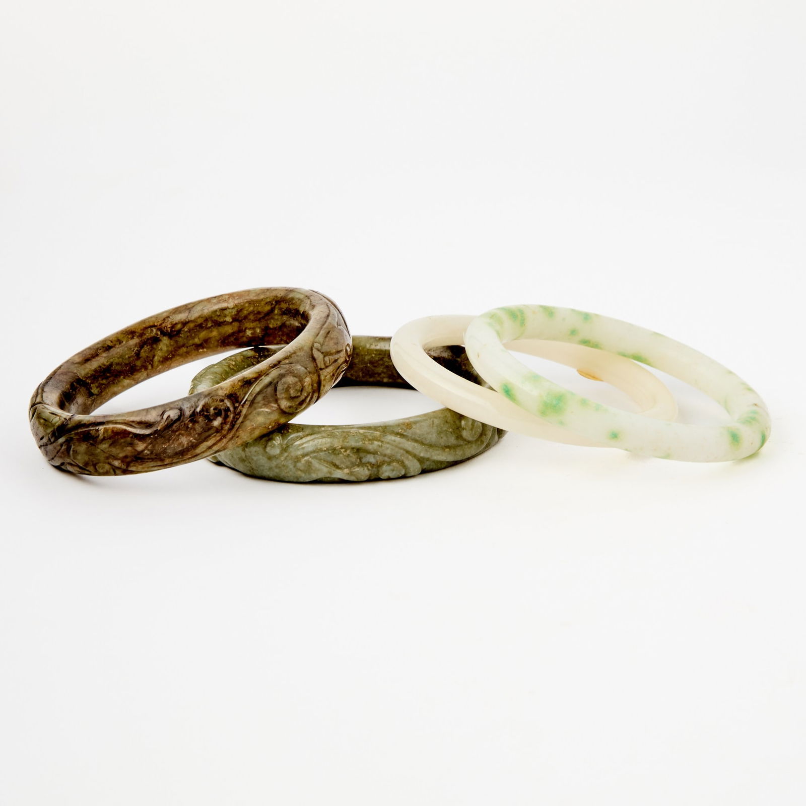 A Group of Four Chinese Jade Bangles Qing Dynasty and Earlier (1 of 3)