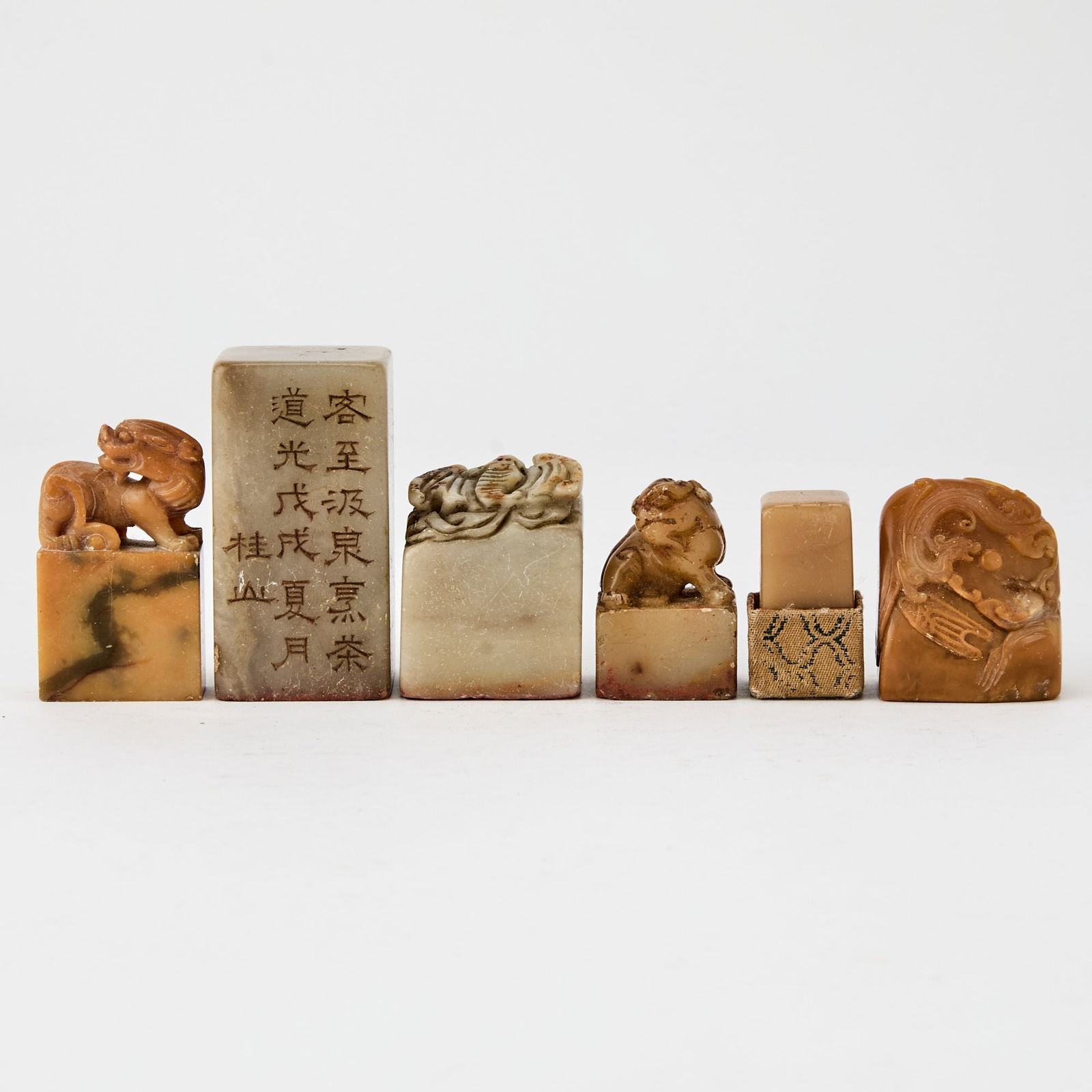 A Group of Chinese Six Soapstone Seals Qing Dynasty: Of varying sizes and styles. (Height of largest 2 1/4 inches)