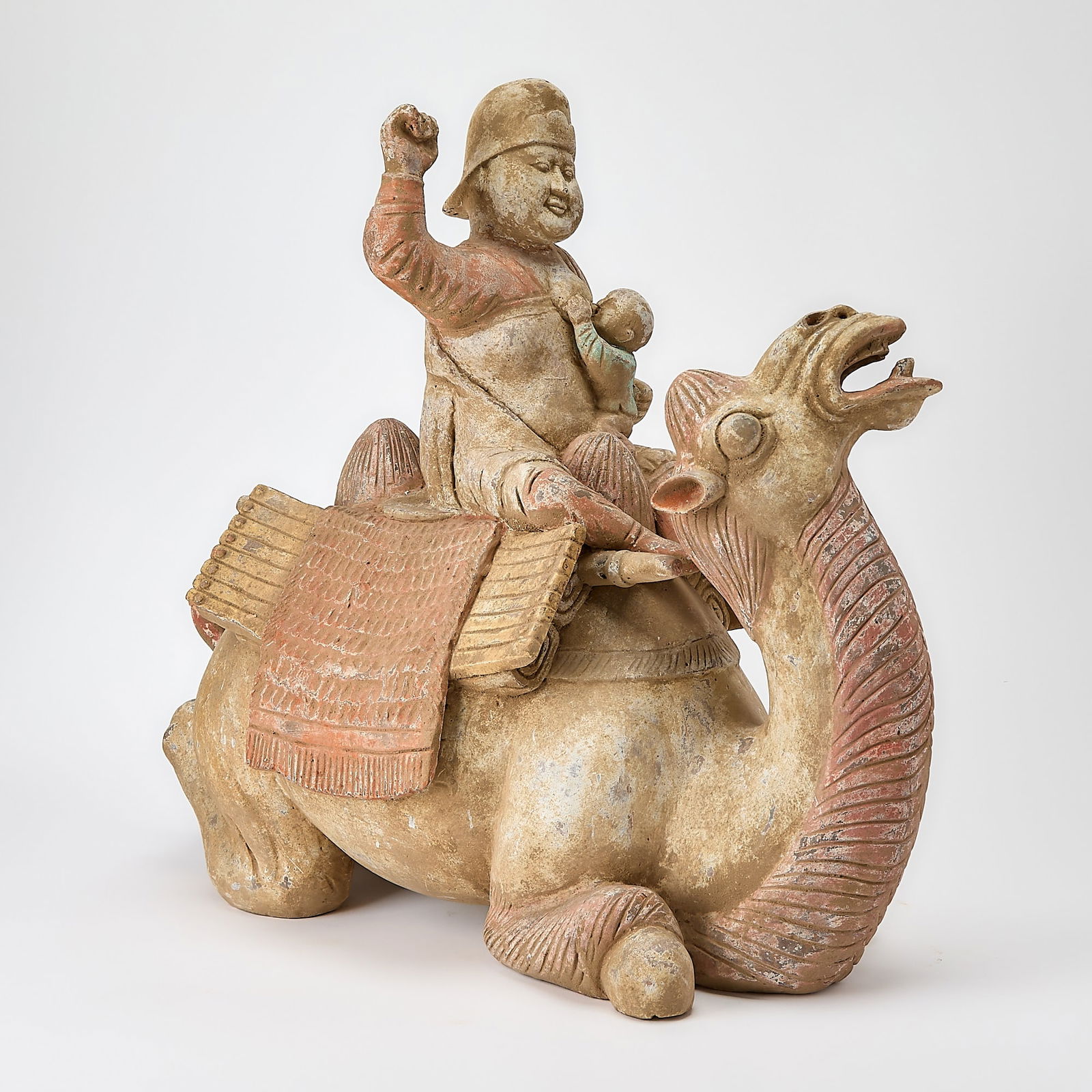 A Chinese Pottery Figure of a Kneeling Camel and Rider Tang Dynasty (1 of 7)