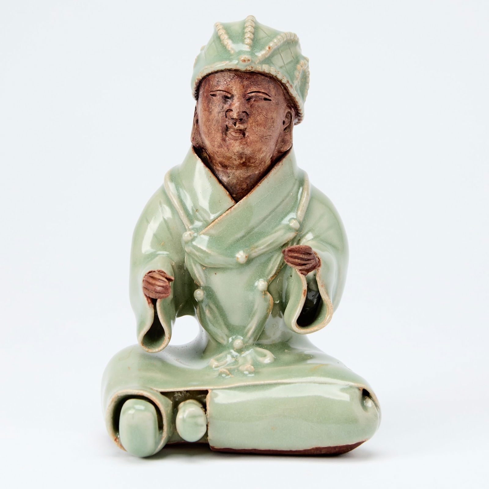 A Chinese Longquan Celadon Seated Figure of a Monk Ming Dynasty or later (1 of 5)