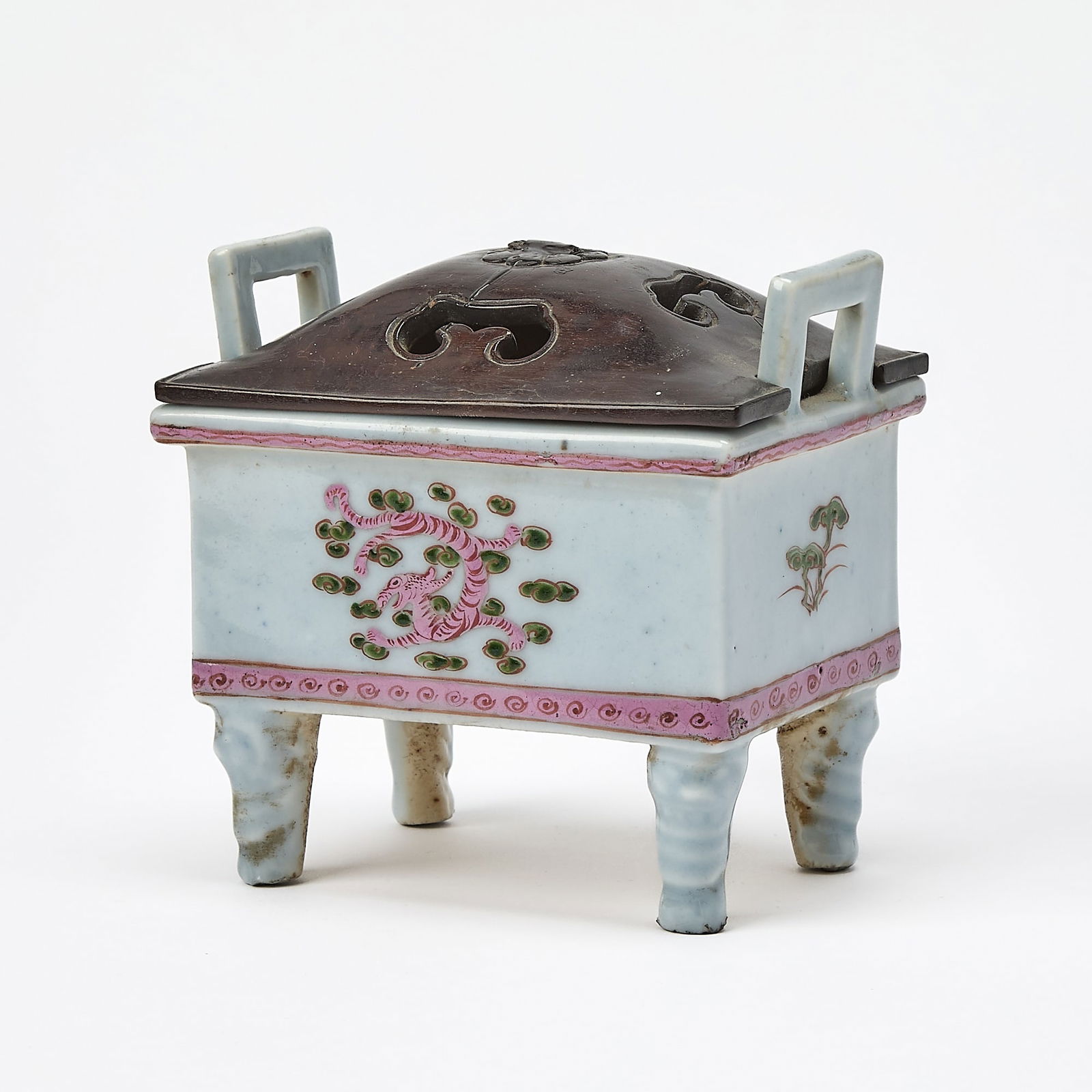 A Chinese Enameled Porcelain Rectangular Censer Late Qing Dynasty: Of fangding form, raised on molded lion-mask legs and decorated in mauve and olive enamels to show qilong and lingzhi within decorative bands; fitted hardwood cover. (Height 4 1/2 inches)