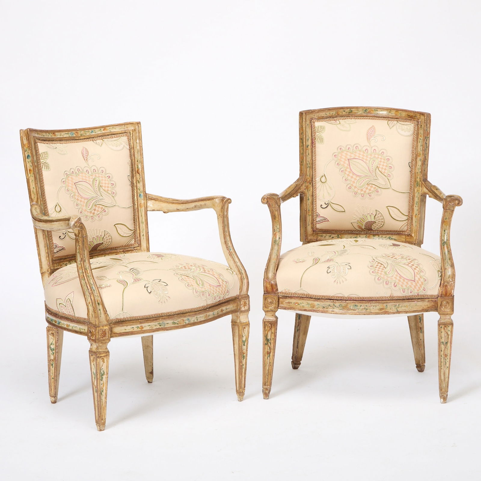 Pair of Swedish Neoclassical Painted Upholstered Armchairs: 19th Century In a floral crewel fabric. Height 33 inches, width 23 inches, depth 22 inches.