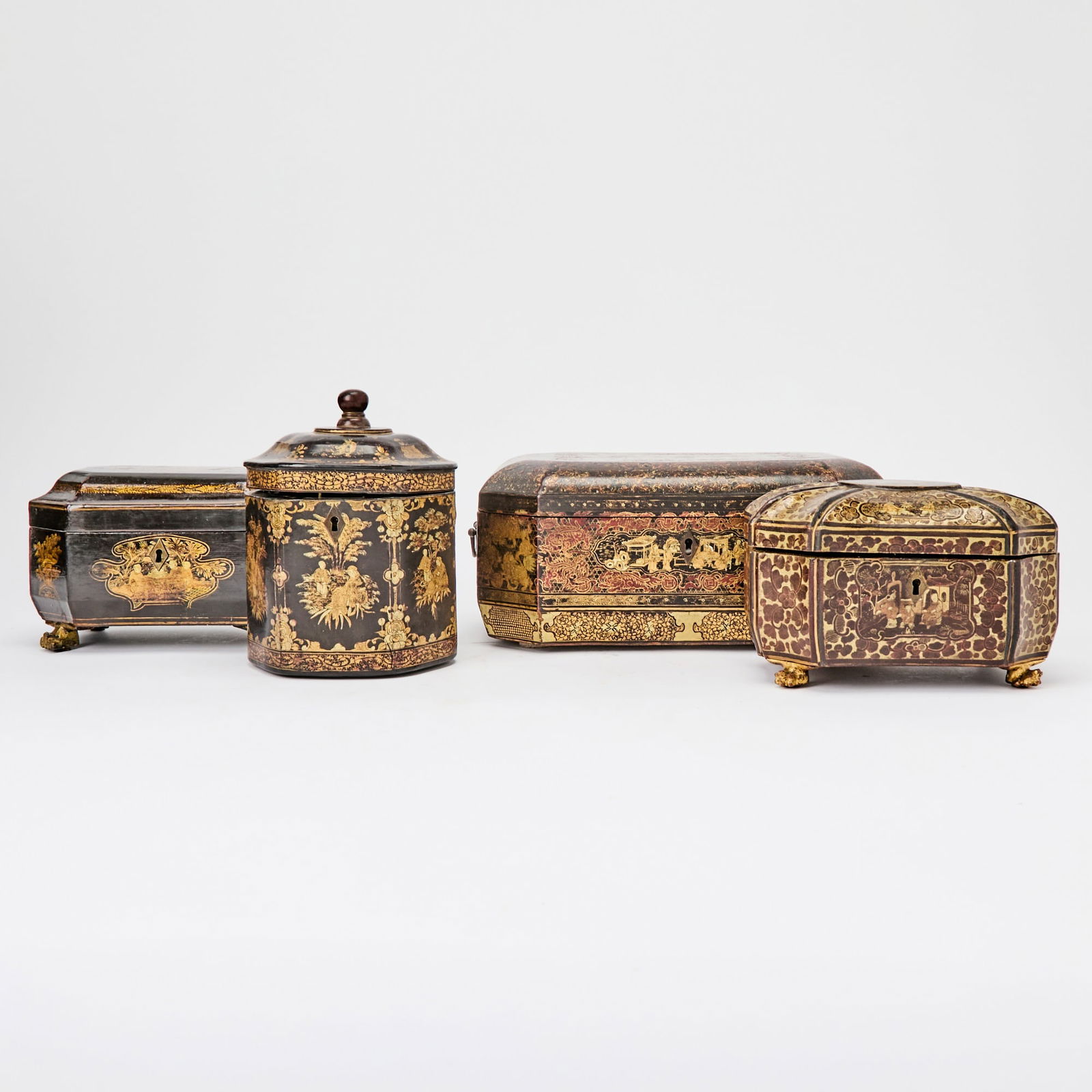 Group of Four Chinese Export Lacquer Boxes: Including two metal-lined tea caddies. Height of largest 5 1/2 inches, width 11 3/4 inches, depth 8 inches.