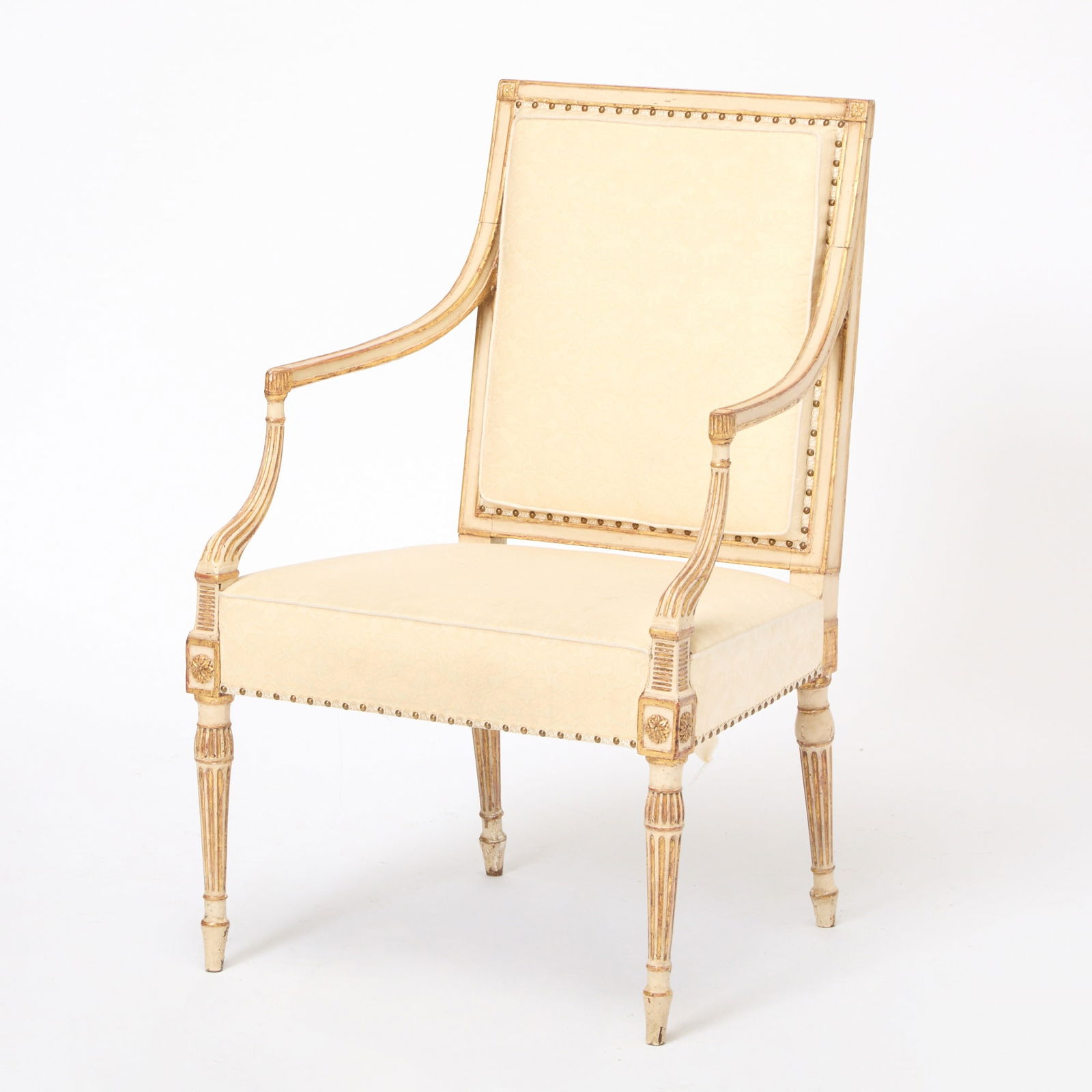 Continental Neoclassical Upholstered Painted and Parcel Gilt Armchair: Late 18th century Height 35 inches, width 22 inches, depth 20 inches. flaking paint
