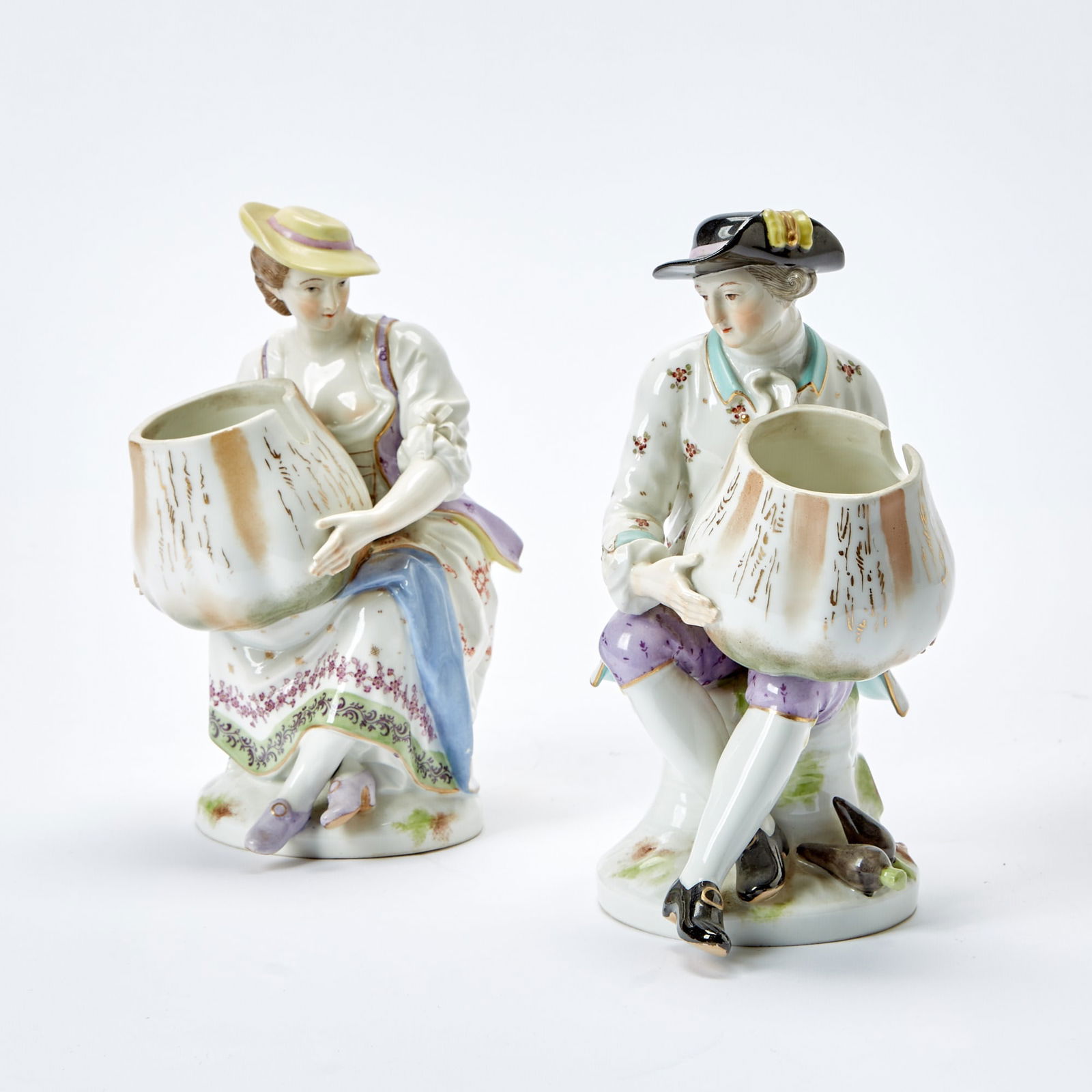Pair of KPM Porcelain Figural Salt Cellars: Height 8 inches. female with one small loss to finger