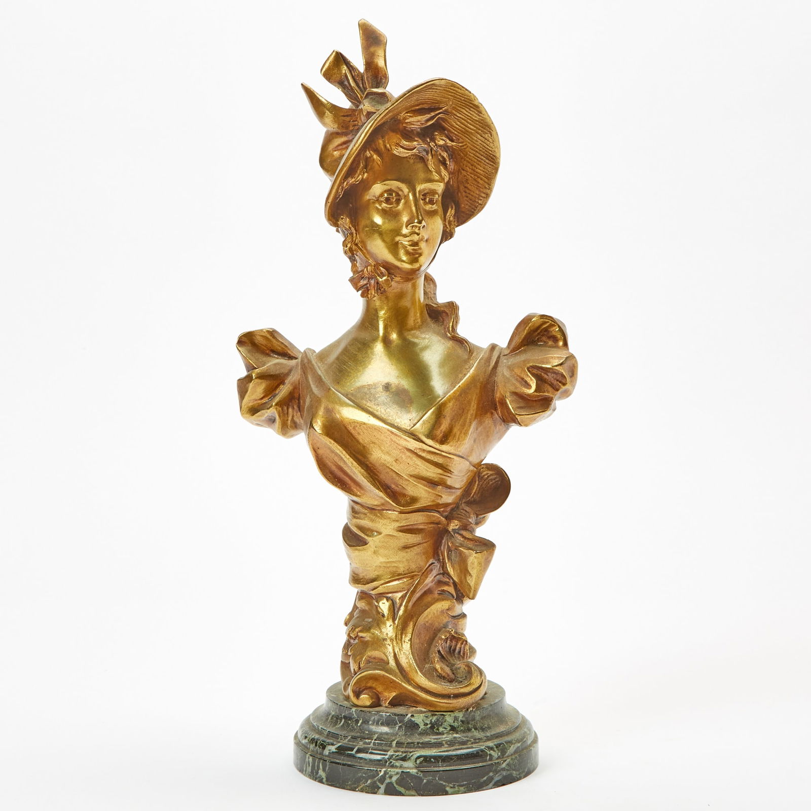 Art Nouveau Gilt-Bronze Bust of a Fashionable Lady: Circa 1900 Raised on a white-veined black marble base. Height 16 1/2 inches, width 8 1/2 inches.