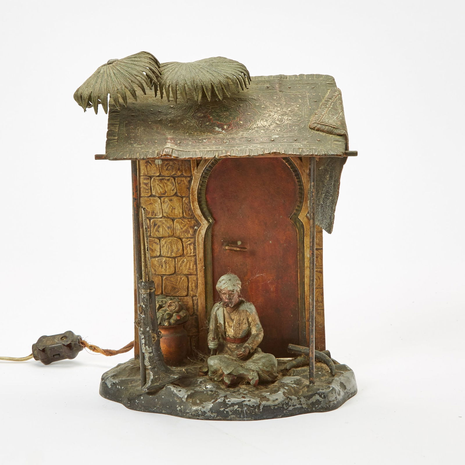 Austrian Cold-Painted Spelter Figural Lamp: Early 20th century Height 10 inches, width 9 1/2 inches, depth 6 inches. losses to paint; wiring very old and probably not in working order