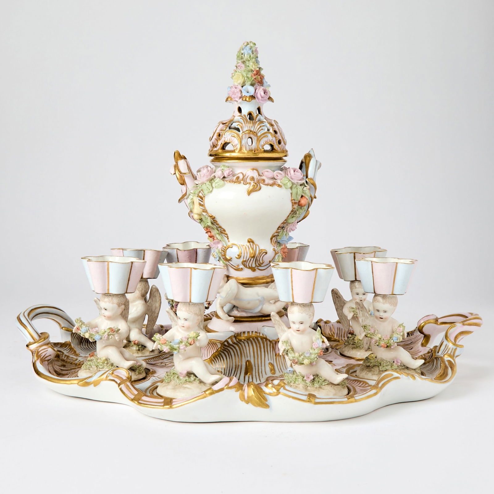 Meissen Porcelain Tea Service: Comprising a two-handled tray, six cups and a central urn with pierced lid (one cup repaired, chip). Dimensions of tray 13 x 18 iches, height of vase 11 inches, height of cups 4 1/2 inches. minor chi