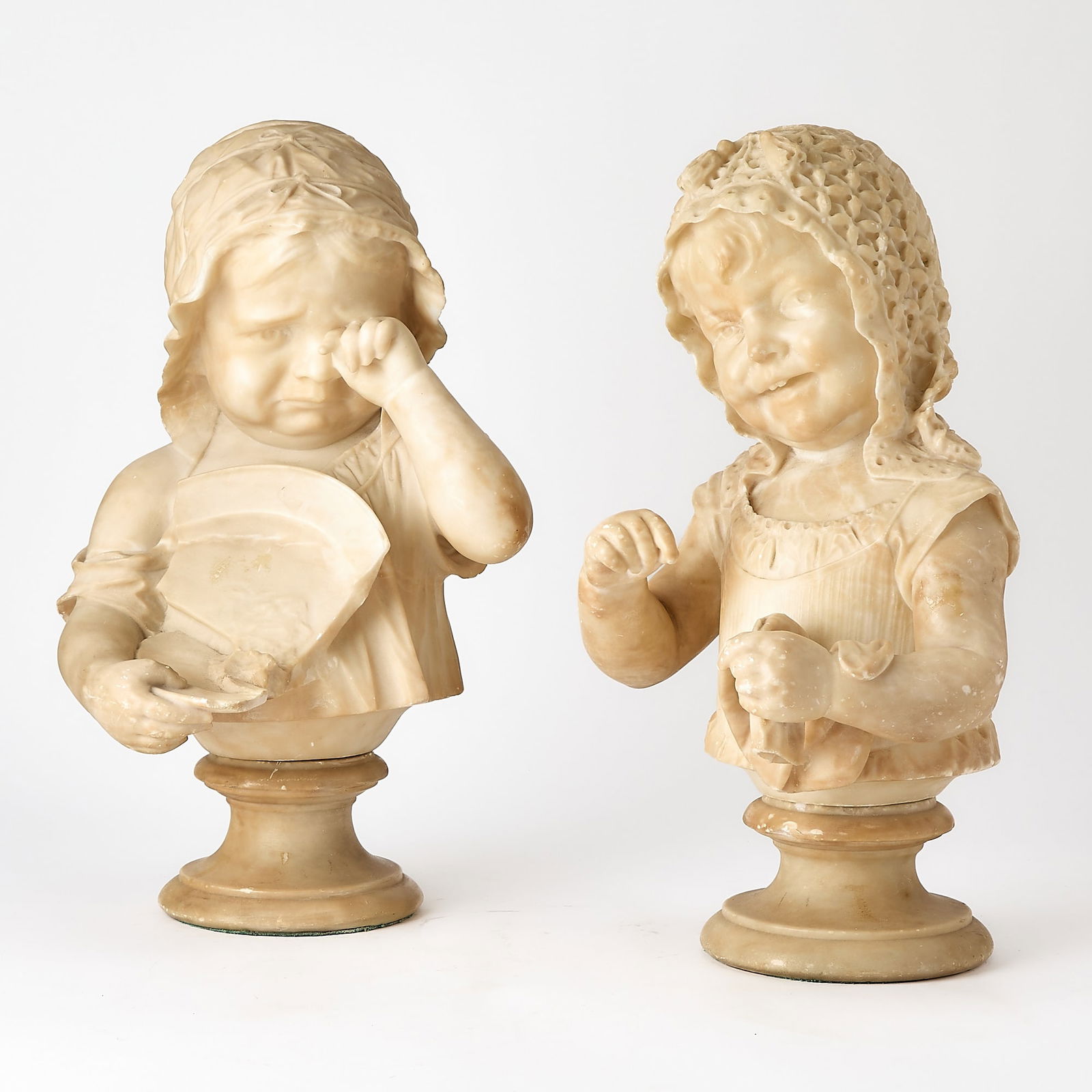 Pair of Italian Alabaster Busts of Young Girls: Early 20th centuryHeights 16 1/2 inches.