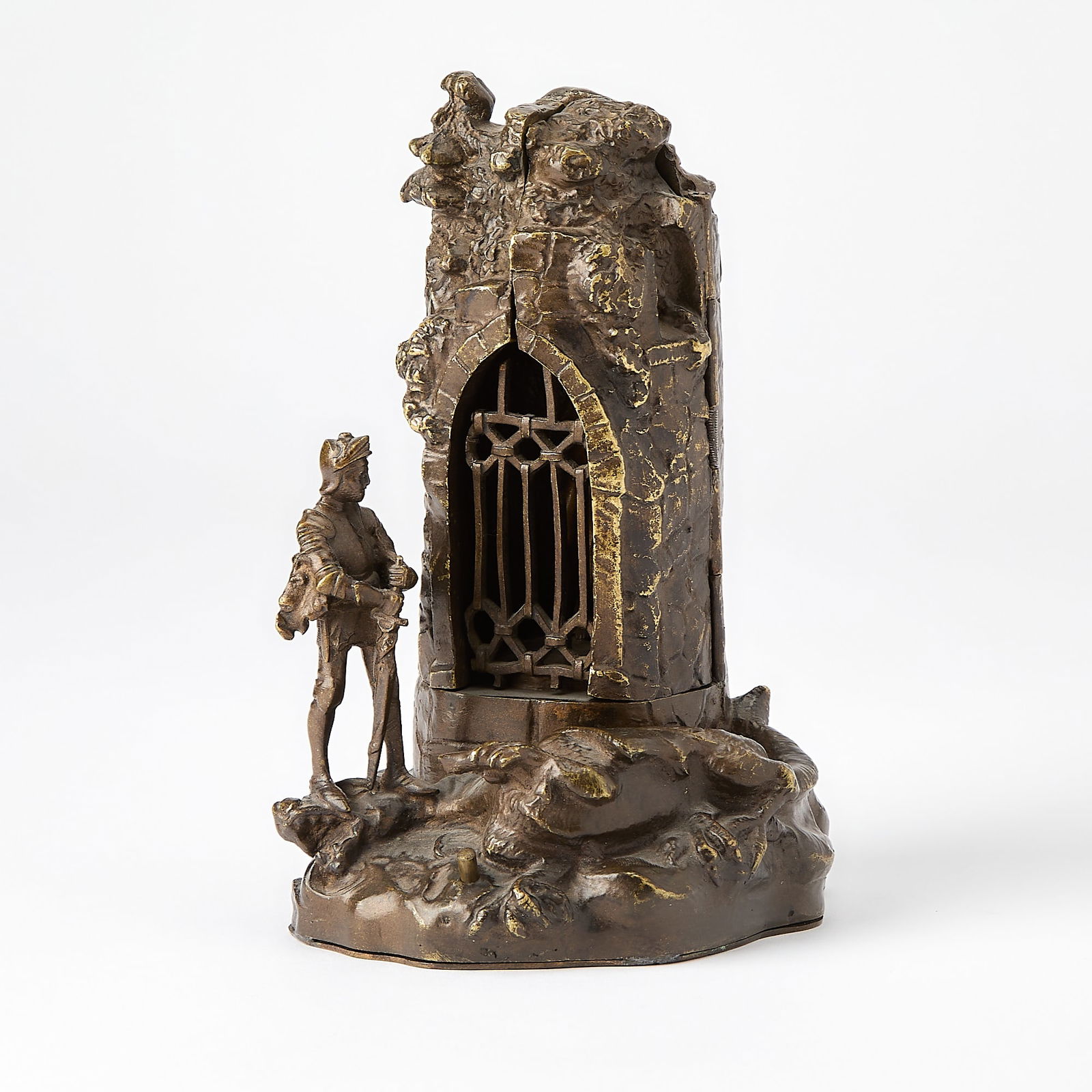 Vienna Patinated and Cold-Painted Bronze Metamorphic Erotic Group Entitled "Dragon Killer's Reward": Circa 1920 The hinged outer case in the form of a stone turret with an arched jail door, fronted by St. George, dressed in a suit of armor, standing on the head and neck of a slain winged dragon, his