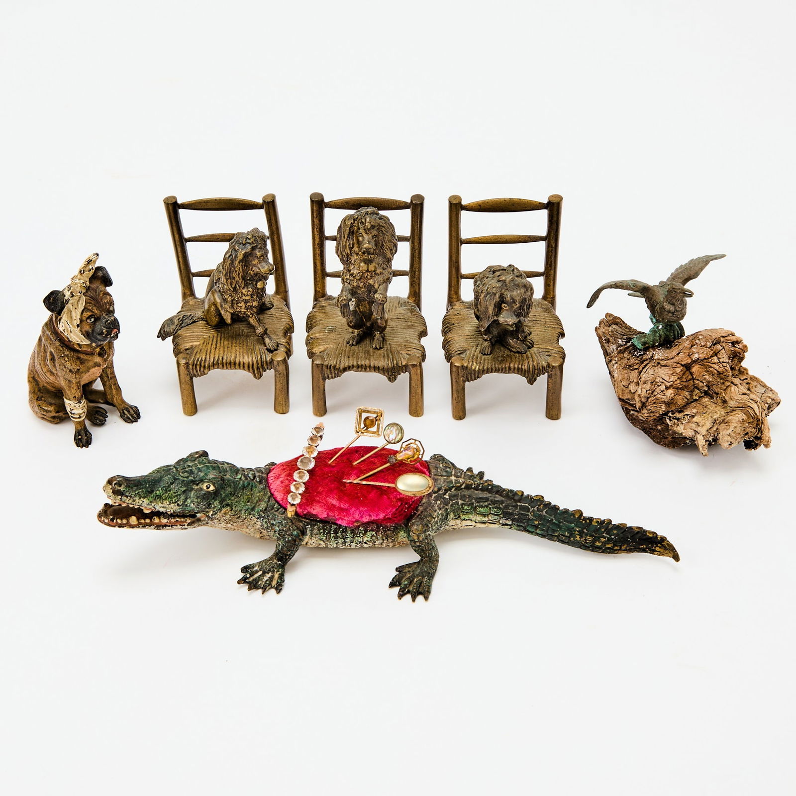 Group of Vienna and Vienna Style Patinated and Cold-Painted Bronze Figures: Circa 1915-25 Comprising a cold-painted bronze figure of a seated English bulldog with a bandaged head and foot, unmarked, height 3 3/8 inches; a cold-painted bronze pen wipe, in the form of an alliga