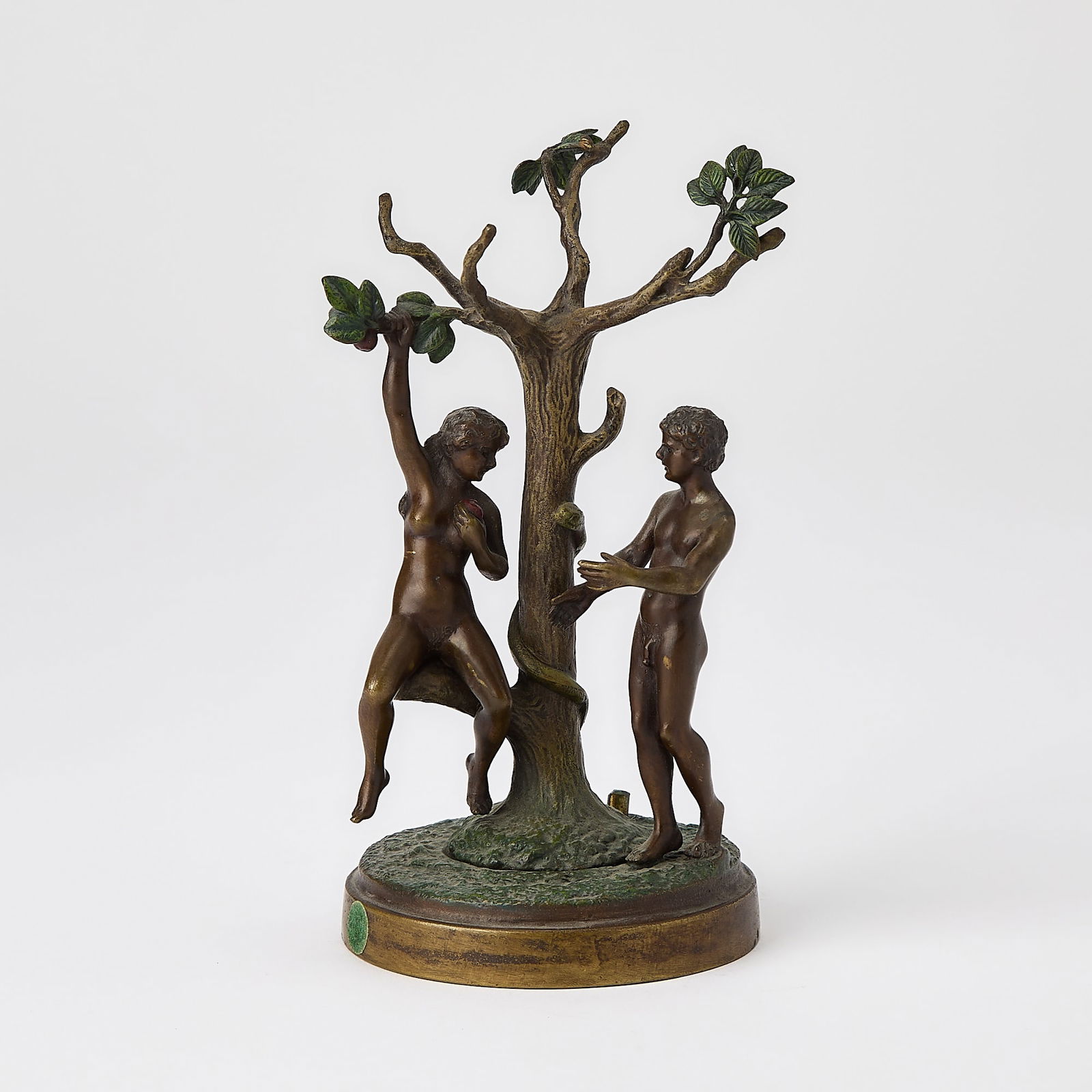Franz Bergman Vienna Cold-Painted Bronze Mechanical Erotic Group Entitled "Adam and Eve": Circa 1915-20 Each figure modeled in the nude, Adam standing beneath a branch of an apple tree, Eve seated on a bottom branch of the tree and holding a red apple, the tree trunk with an entwined serpe