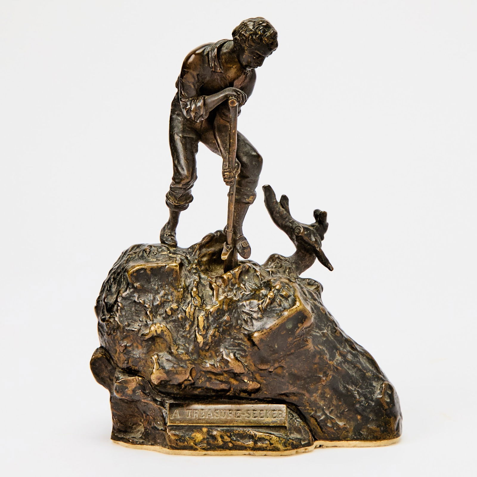 Carl Kauba Vienna Cold-Painted Bronze Metamorphic Erotic Group Titled "A Treasure Seeker": Circa 1915-25 In two parts, the upper section modeled as a young male treasure seeker driving his shovel into a mound of earth, lifting straight up to reveal the lower section, modeled as a slumbering