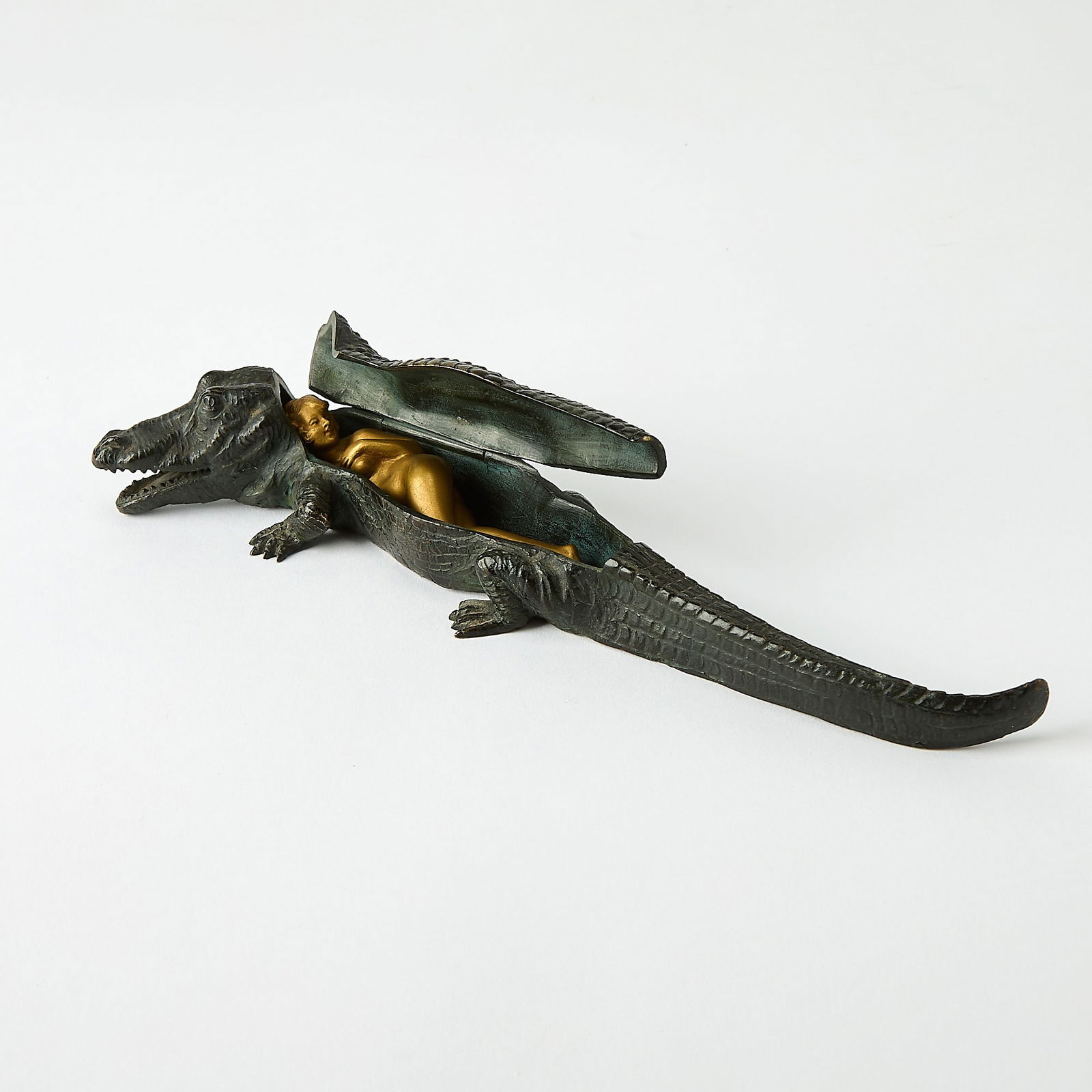 Vienna Cold-Painted Erotic Group of an Alligator and Concealed Woman: Attributed to Franz Bergman, 1920sThe hinged cover opening to reveal a nude young woman concealed inside, impressed AUSTRIA.Length 9 1/4 inches. appears to be in generally good, undamaged condition;