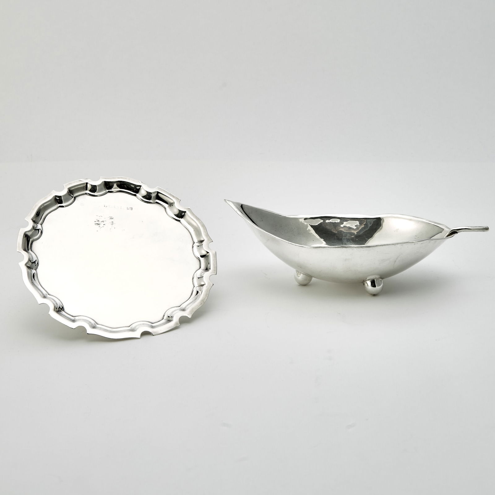 Sciarrotta Sterling Silver Leaf Dish and English Sterling Silver Waiter: 20th Century Length of leaf dish 8 1/2 inches; diameter of waiter 6 inches, total approximately 8 ounces. Generally good condition overall with light wear from casual use; rubbing to English hallmar