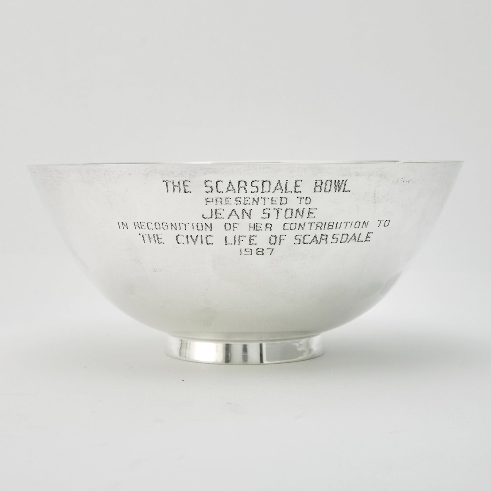 Tiffany & Co. Sterling Silver Bowl: Mid 20th century Of circular form, on a ring foot. Height 4 inches, diameter 9 inches, approximately 24 ounces. Generally good condition overall with light wear from casual use; engraved presentation