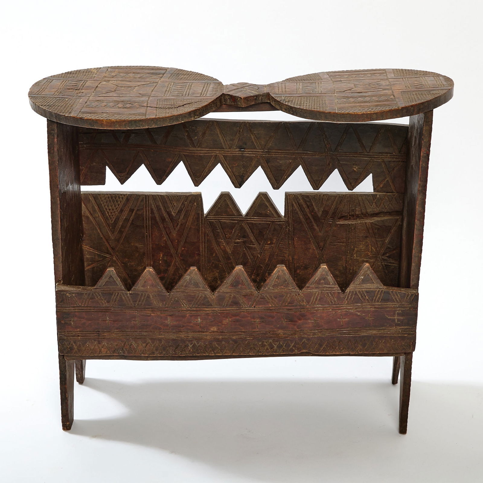 Nupe Twin Lobe Wood Stool / Table: Height 18 inches, width 21 1/2 inches, depth 10 inches. cracks and wear throughout; being sold AS-IS