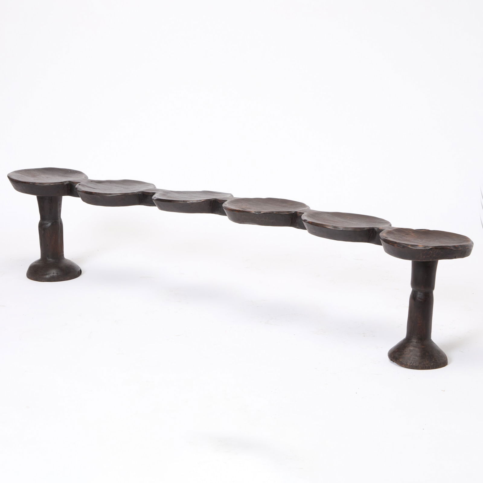 Large Tribal Wood Bench: 20th Century Height 17 inches, width 7 feet 4 inches, depth 13 inches.