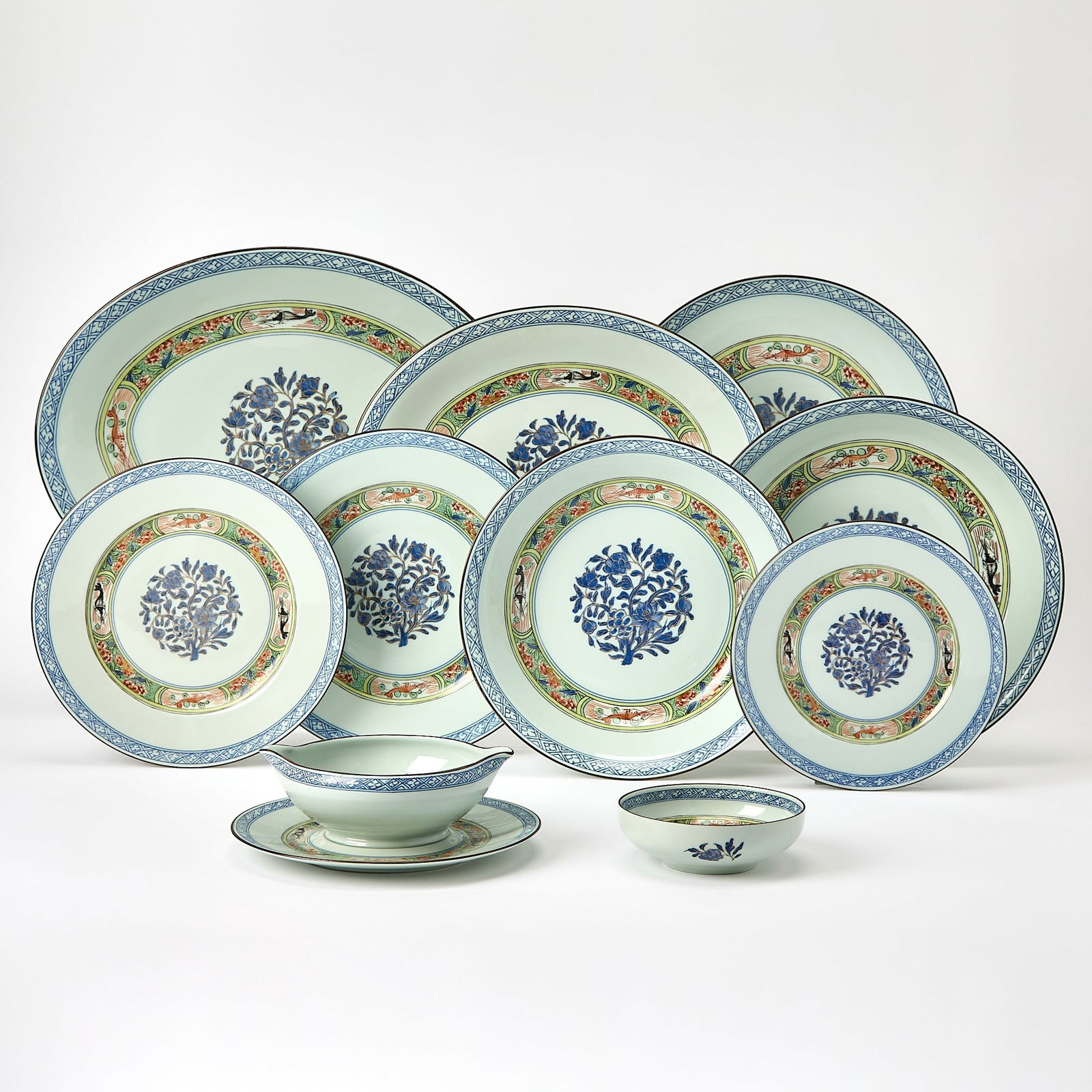 Puiforcat Limoges "Kan Sou" Pattern Porcelain Dinner Service: Comprising: Seven dinner plates, diameter 9 1/2 inches Eight plates, diameter 8 inches Eight plates, diameter 7 1/2 inches Four small bowls Two gravy boats