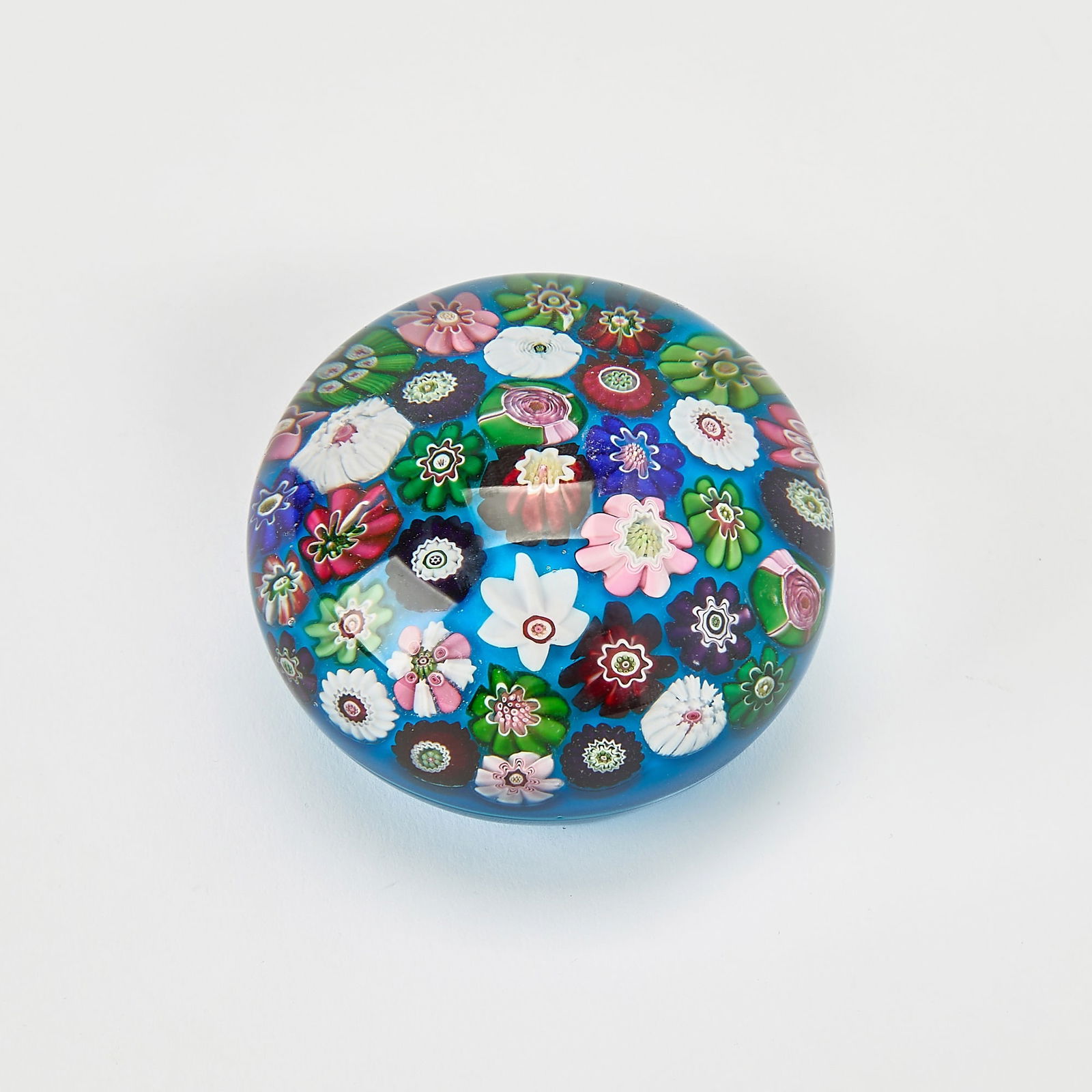 Clichy Spaced Millefiori on Cerulean Blue Glass Paperweight: Height 2 1/4 inches, diameter 3 1/4 inches.