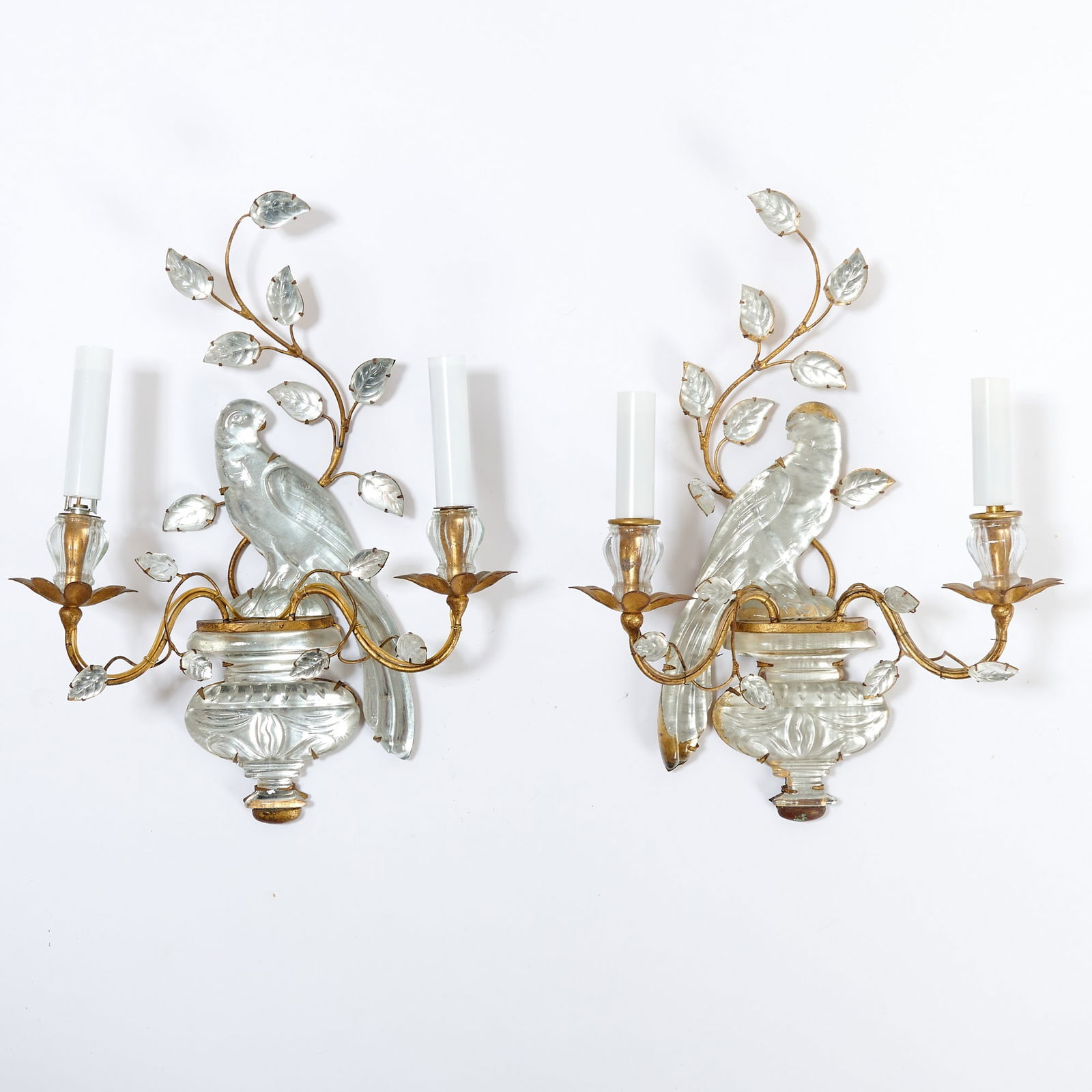 Pair of Bagues Style Glass Bird Two-Light Wall Sconces: Each with a backplate in the form of a left or right-facing bird perches on an urn. Height 15 inches, width 12 inches.