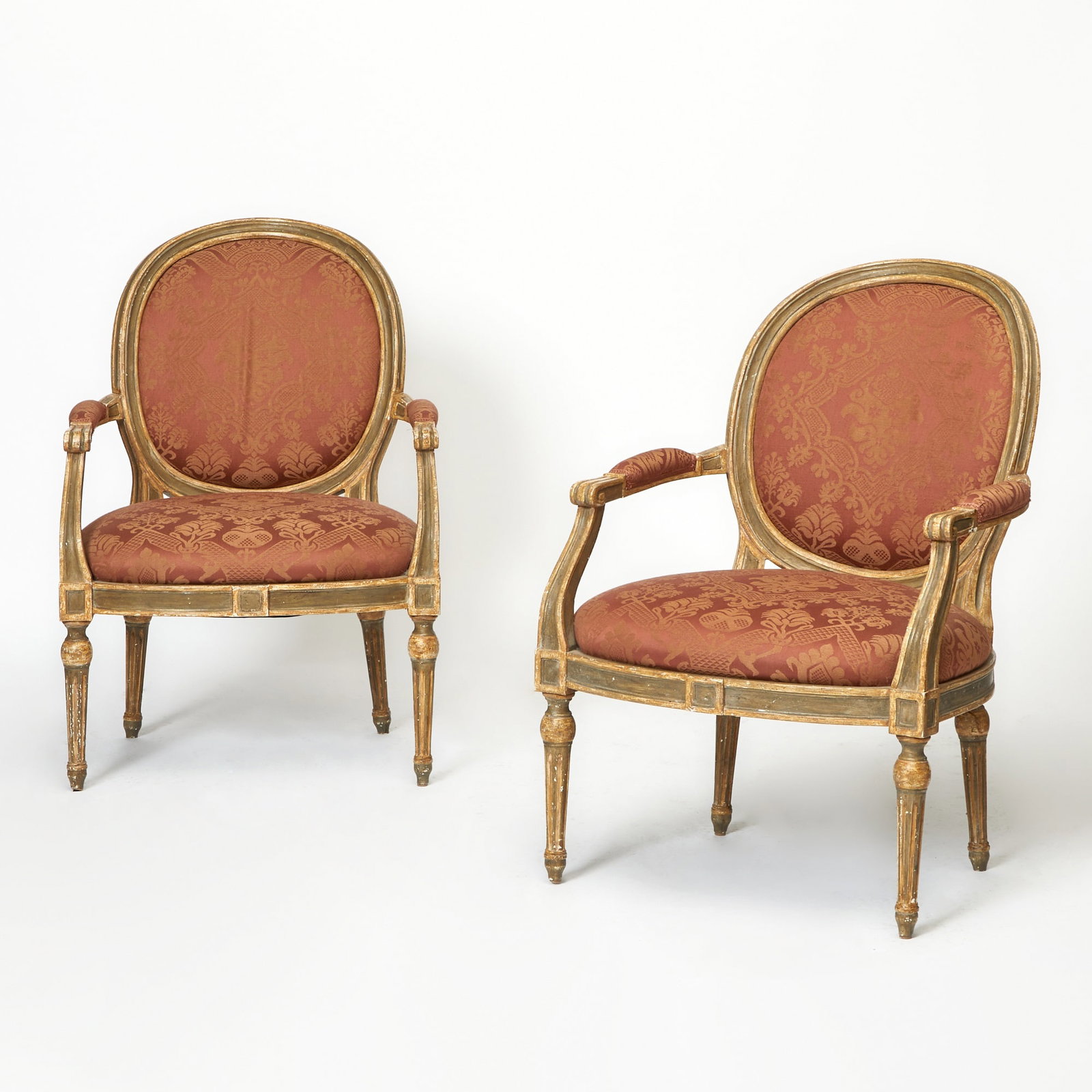 Pair of Louis XVI Style Painted Upholstered Fauteuils: Height 38 1/2 inches, width 26 1/2 inches, depth of seat 21 inches, height of seat 17 inches. minor paint losses and edgewear; presents well