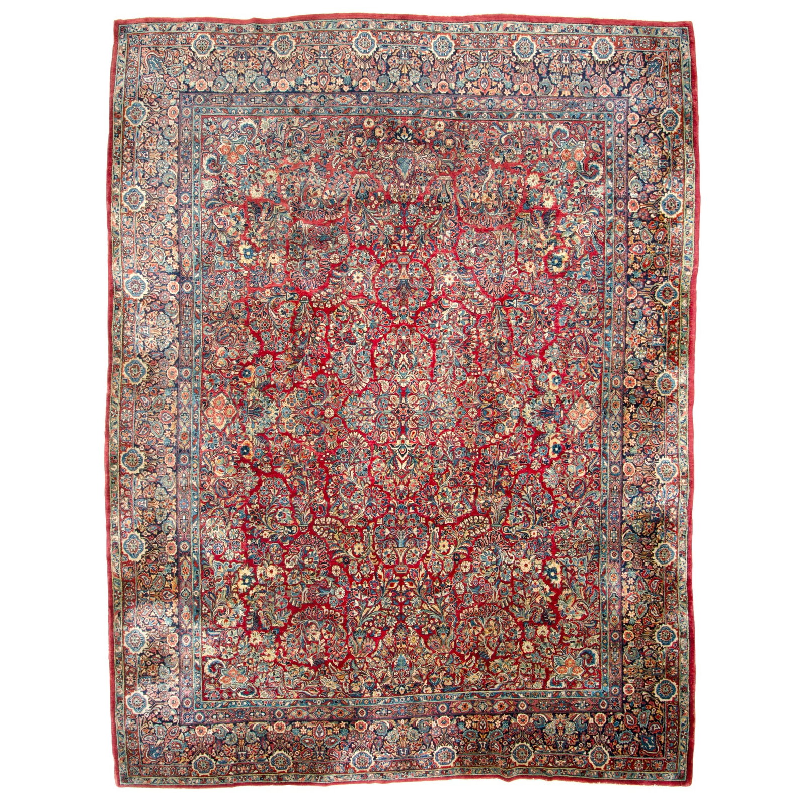 Sarouk Carpet: North Iran, Mid-20th centuryThe madder field with a central medallion flanked by sprays is within a midnight blue flowering vase border. (15' 10" x 11' 11")
