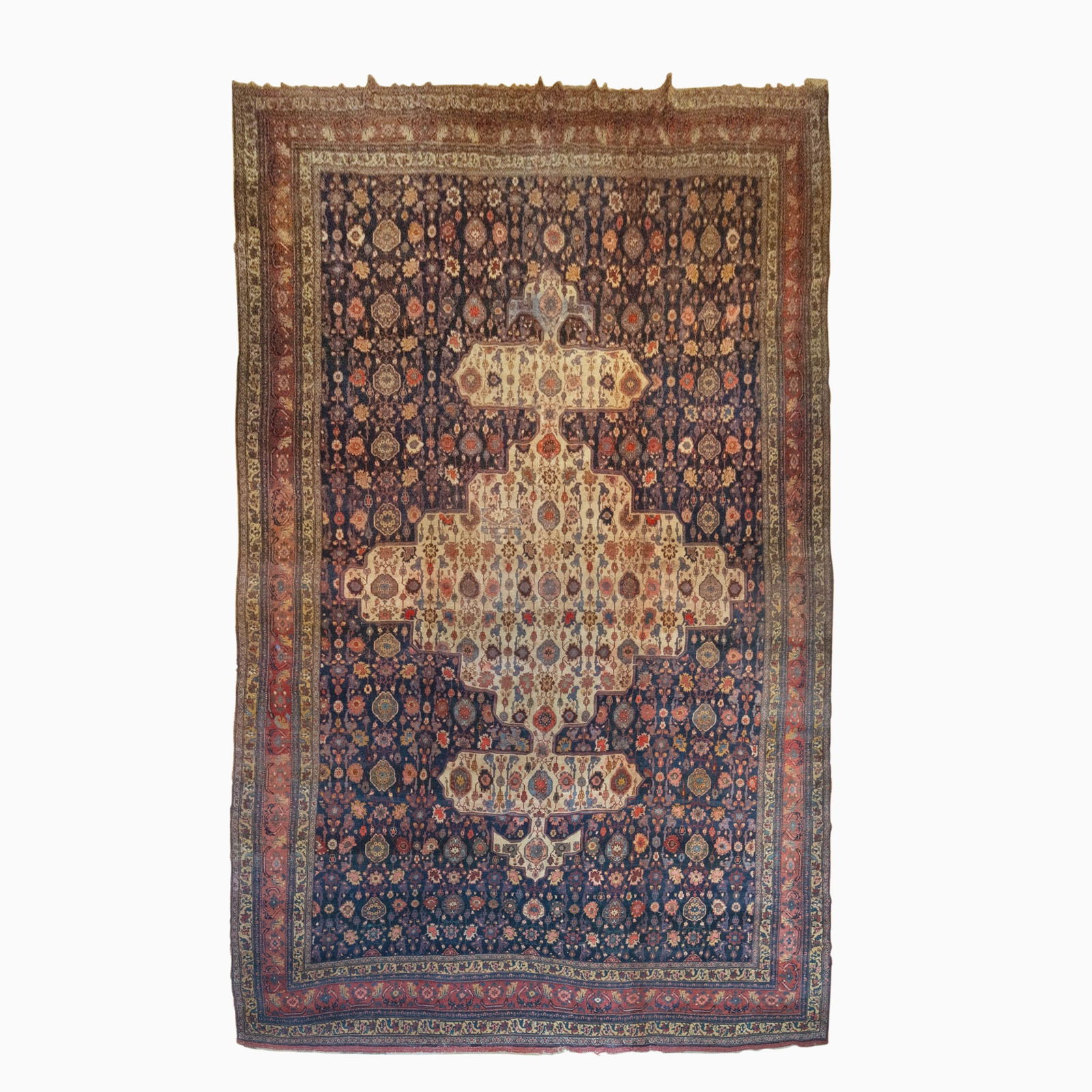 Bidjar Carpet: North Persia, circa 1900The central pendant medallion on the indigo field is within a madder rosette border. Wool foundation. (23' 8" x 13' 3") Moth damage, 8" x 10" and 5" x 3" patches, stains,