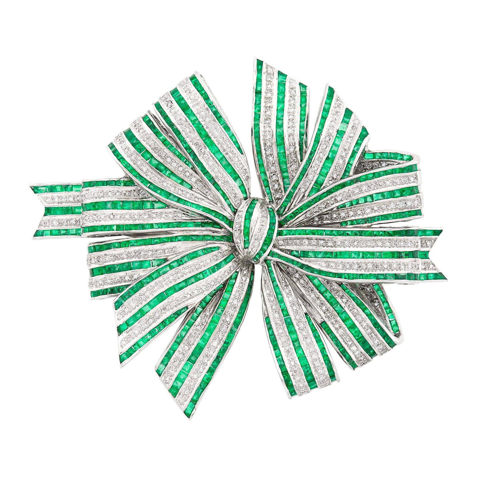 Oversized White Gold, Emerald and Diamond Bow Clip-Brooch: 18 kt., rectangular and square-cut emeralds, round diamonds weighing 2.11 cts., weight inscribed, ap. 41.3 dwts. Emeralds: bright medium to medium deep green to very slightly bluish-green, slightly t