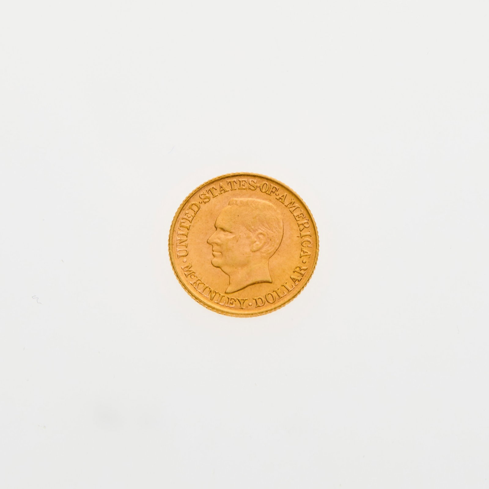 United States. 1916 McKinley Commemorative Gold Dollar. Uncirculated.: Nice luster. PCGS #: 7454; NGC ID#: BYLK. Fineness: 0.900 AGW: 0.0484 oz.