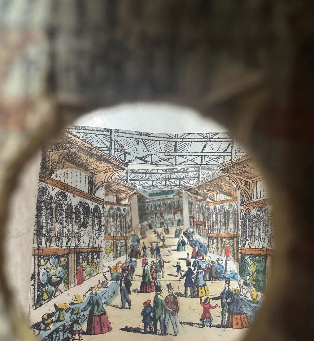 Peepshow perspective view of the Crystal Palace: [PERSPECTIVE VIEW] Interior of the Magnificent New Crystal Palace at Sydenham. London: circa 1854. Hand-colored, six division concertina-paper peepshow, with four mounted sections and a central ape