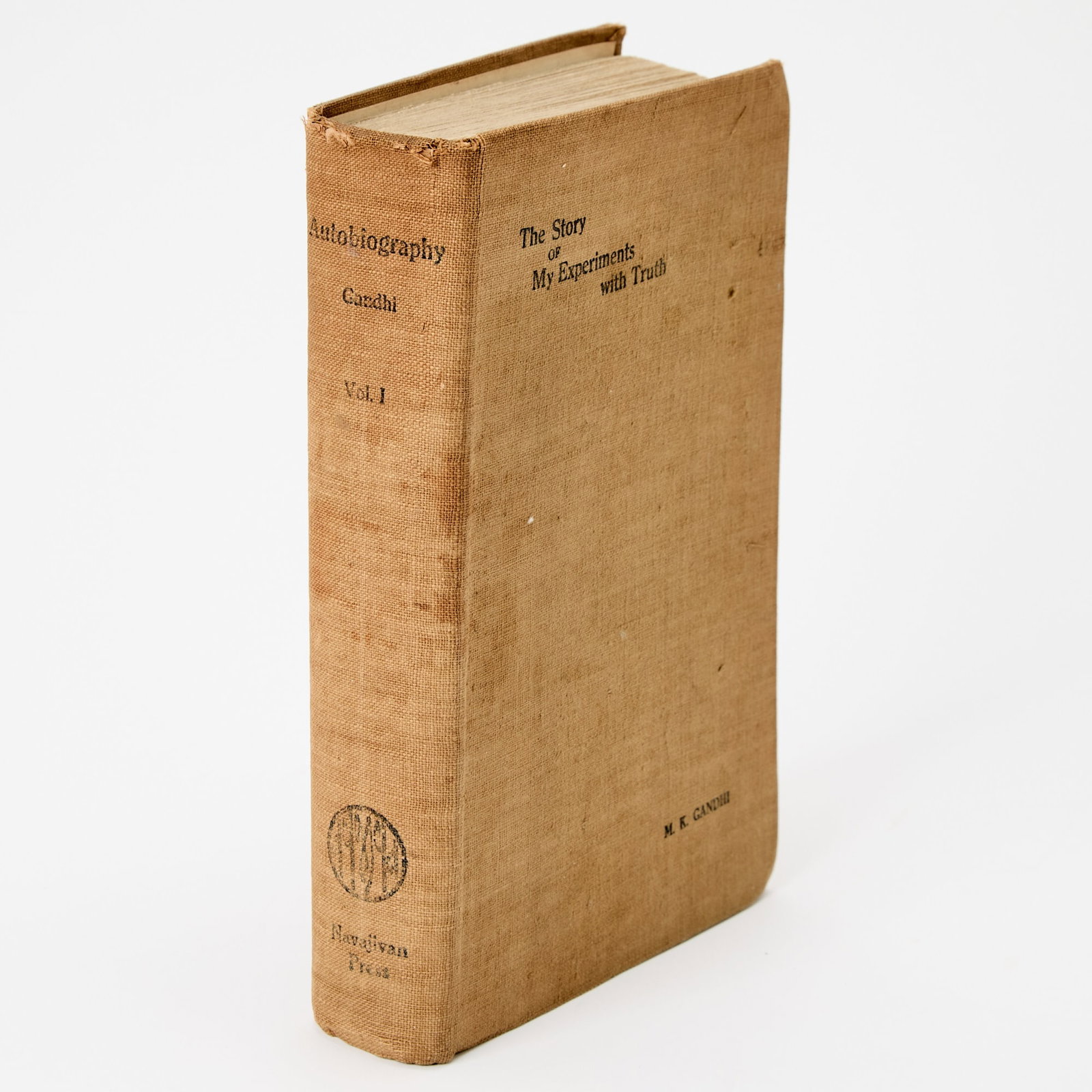 Gandhi's Experiments with Truth, volume one: M.K., GANDHI The Story of My Experiments with Truth. Ahmedabad: Navajivan Press, 1927. First edition. Volume I only (Volume II issued in 1929). Publisher's buckram. Rubbed and shaken, stains to cover