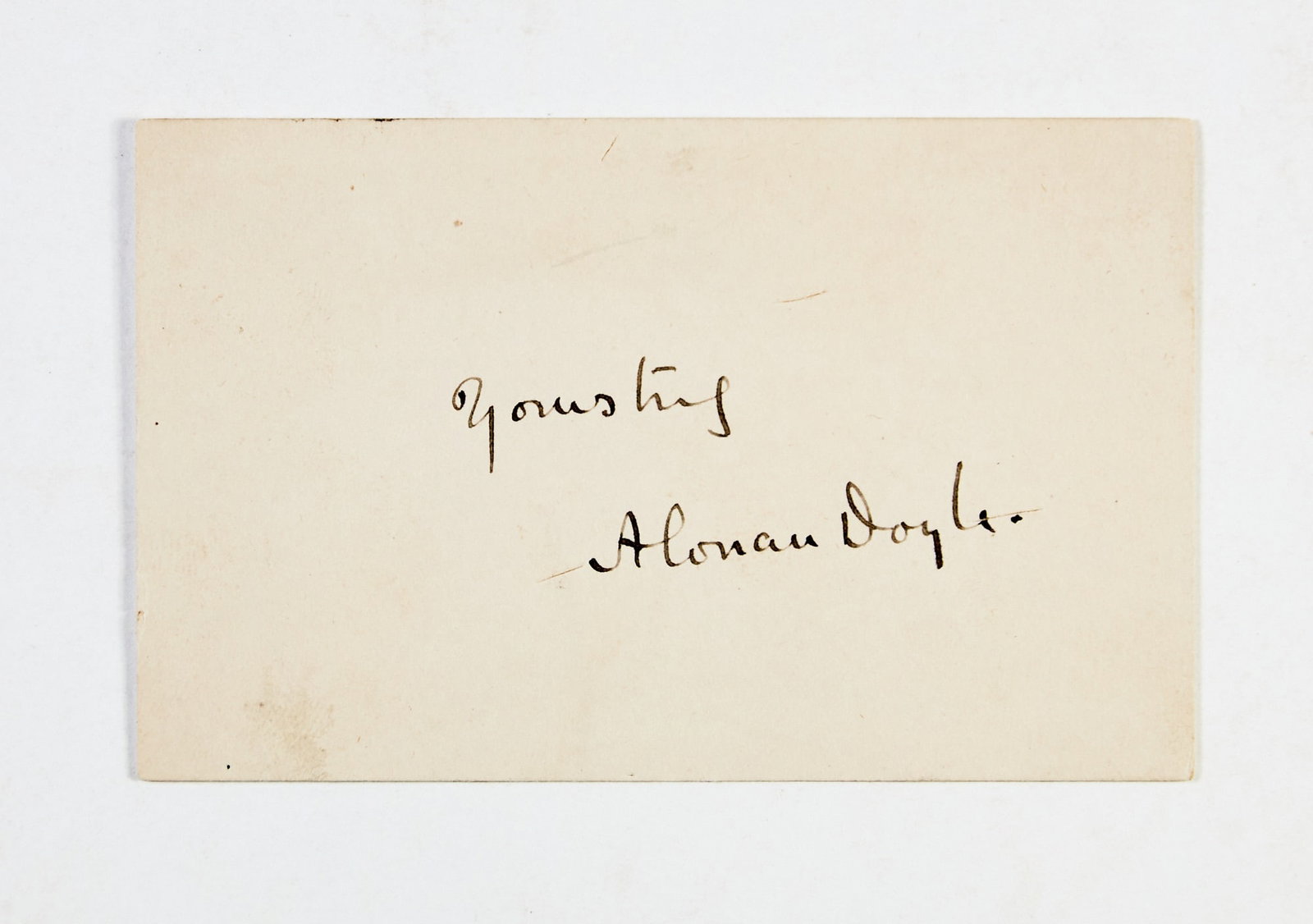 An Arthur Conan Doyle signature: CONAN DOYLE, ARTHUR Arthur Conan Doyle signature on a card "Yours Truly /A. Conan Doyle." 2 1/4 x 3 1/2 inches (5.75 x 9 cm); pasteboard with inscription in black ink. Minor toning.
