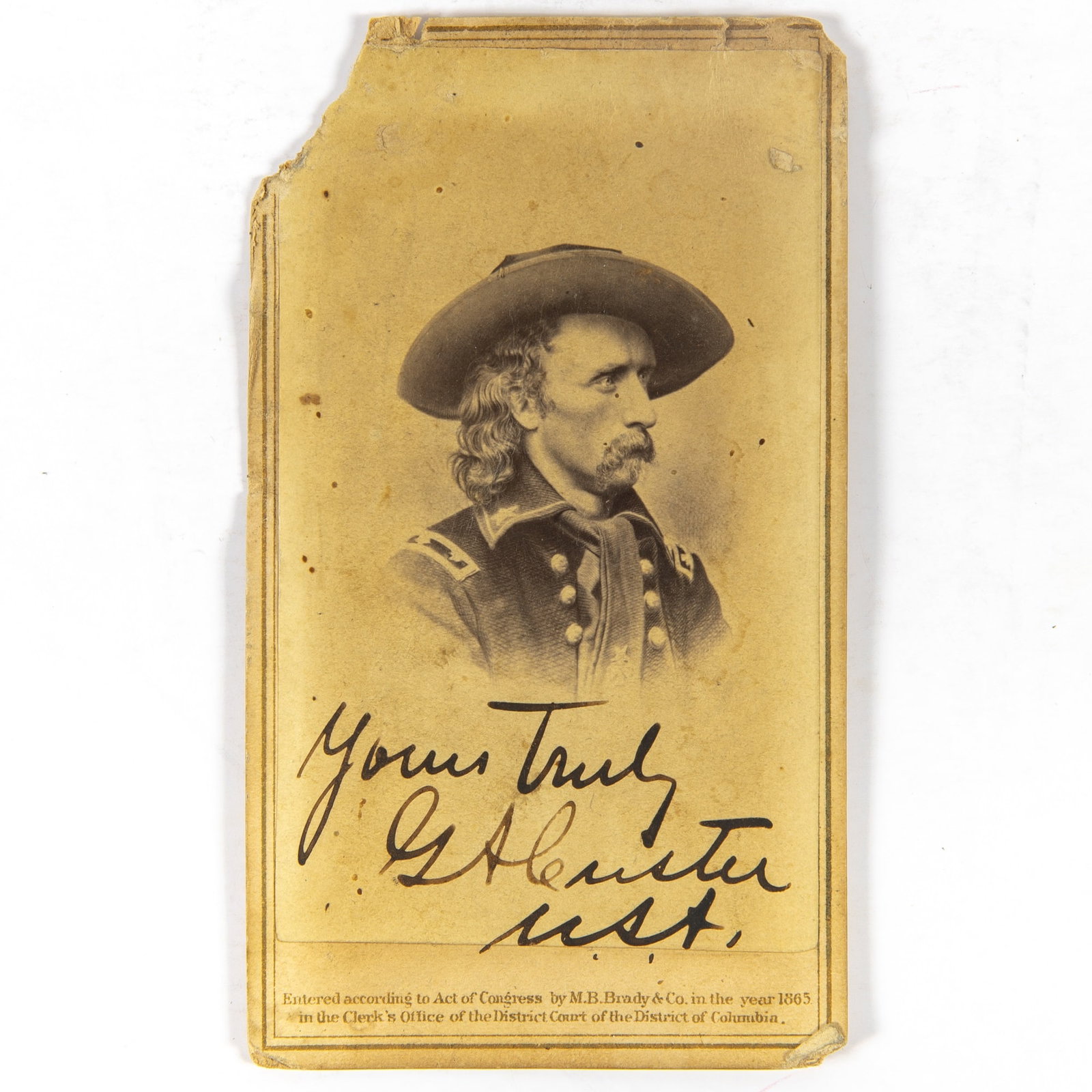 Signed General Custer carte de visite: CUSTER, GEORGE ARMSTRONG A rare signed carte de visite of General Custer by Mathew Brady. Albumen print, mounted to publisher's card, circa 1865, the photograph by Mathew Brady. 2 1/2 x 3 3/4 inches