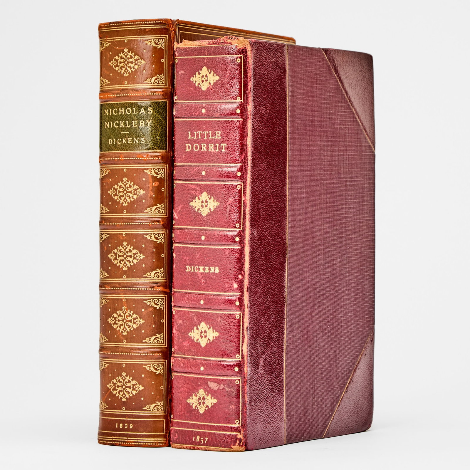 Two first editions by Dickens: DICKENS, CHARLES The Life and Adventures of Nicholas Nickleby. London: Chapham and Hall, 1839. First edition, first issue in book form; with all first issue points. Bound by Birdsall in full chestnut