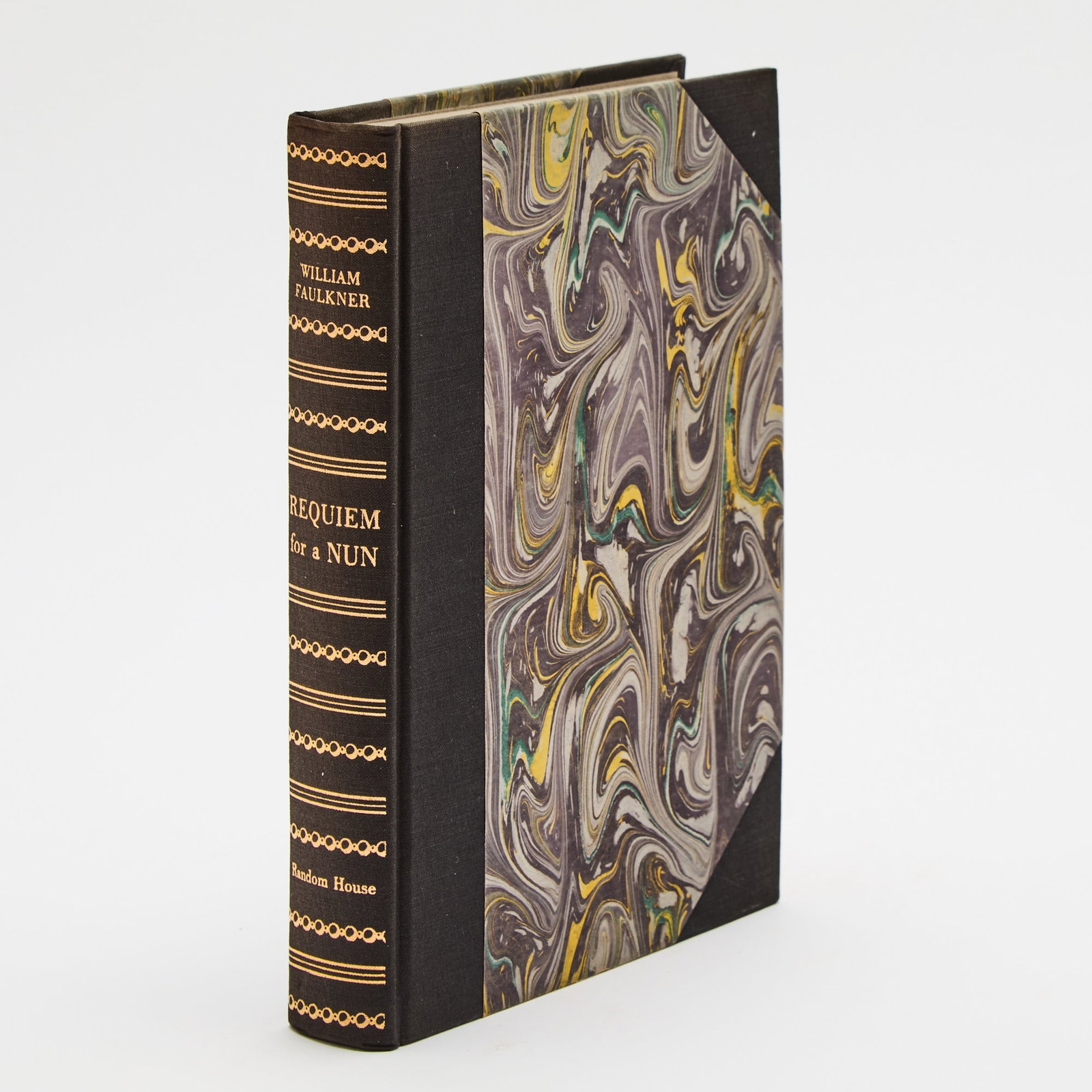 Limited and signed edition of Faulkner's Requiem for a Nun: FAULKNER, WILLIAM Requiem for a Nun. New York: Random House, 1951. First edition. Limited to 750 numbered copies signed by Faulkner, this being number 661. Publisher's three quarters cloth-backed mar