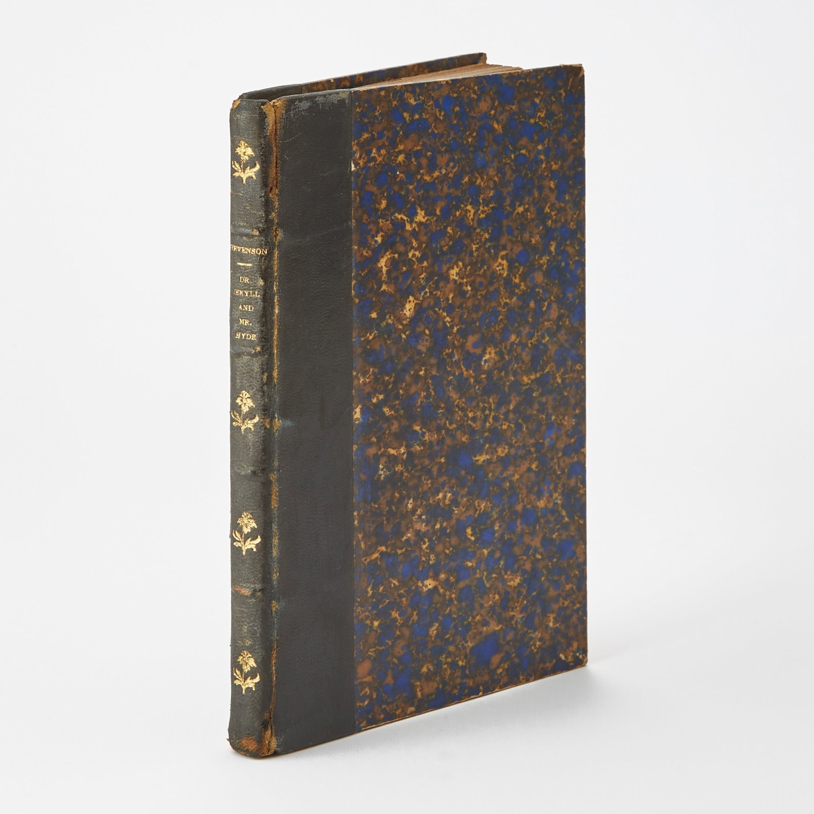 An early pirated New York edition of Dr. Jekyll and Mr. Hyde: STEVENSON, ROBERT LOUIS The Strange Case of Dr. Jekyll and Mr. Hyde. New York: George Munro, circa 1897? An early pirated edition. Contemporary morocco backed marbled boards, without wrappers. 7 x