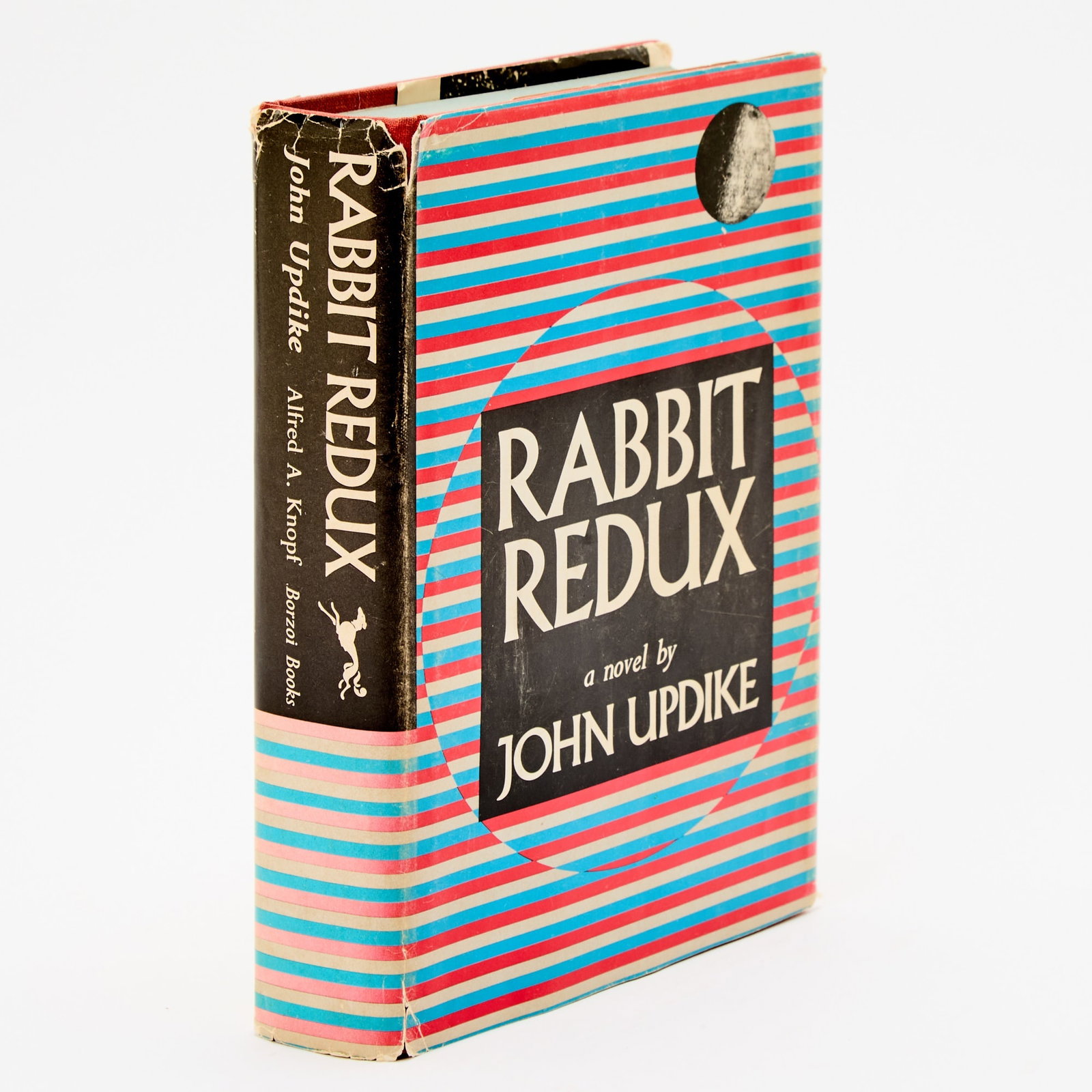 First edition of Rabbit Redux, signed by Updike: UPDIKE, JOHN Rabbit Redux. New York: Knopf, 1971. First edition, signed by Updike on half-title. Publisher's red cloth lettered in silver, dust jacket. Jacket toned with some short chips and tears to