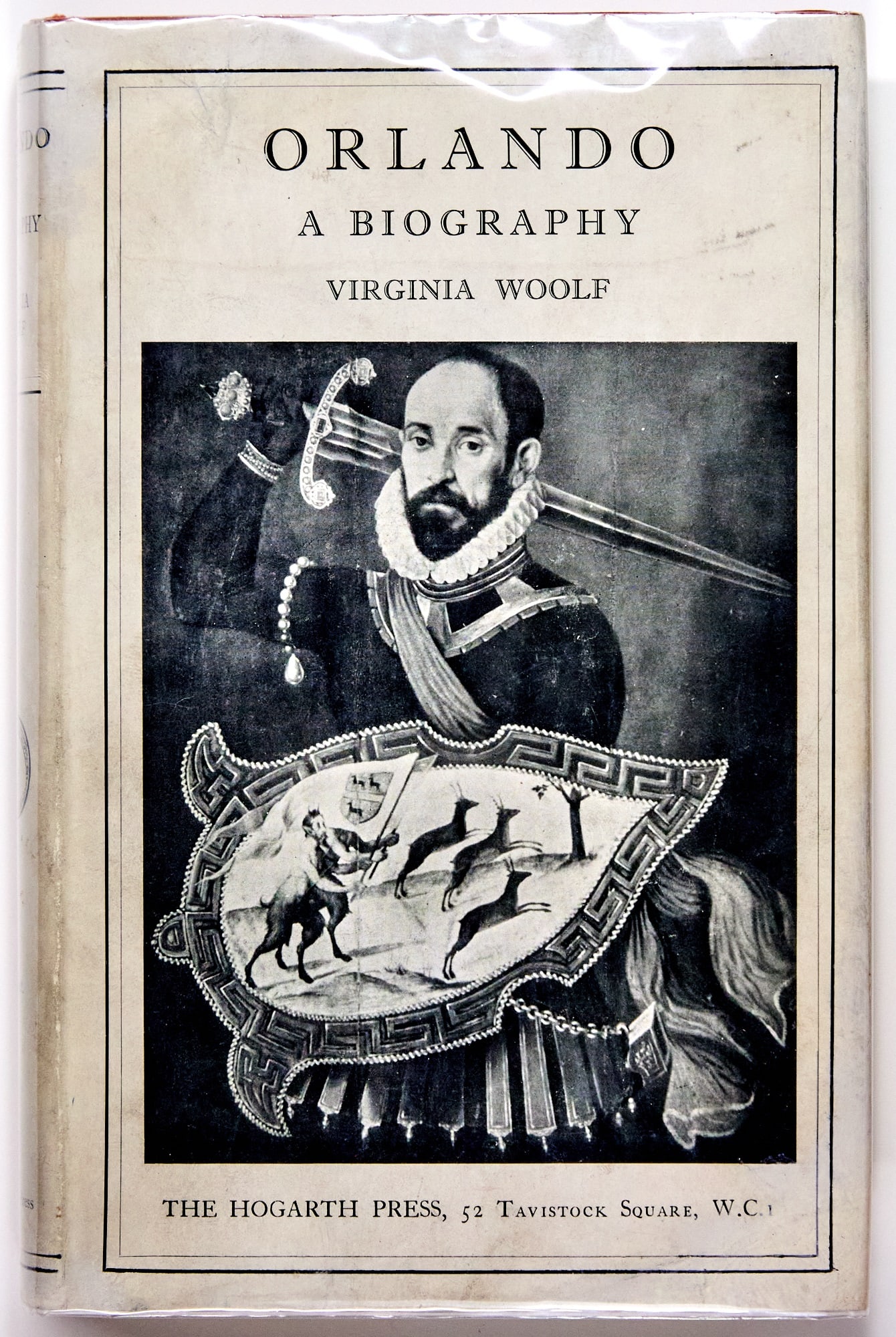 The first edition of Orlando, in jacket: WOOLF, VIRGINIA Orlando: A biography. London: Hogarth Press, 1928. Publisher's orange cloth with dust jacket, 8 3/4 x 5 3/4 inches (22 x 14.5 cm). 299 pp, eight plates. The binding slightly rubbed and