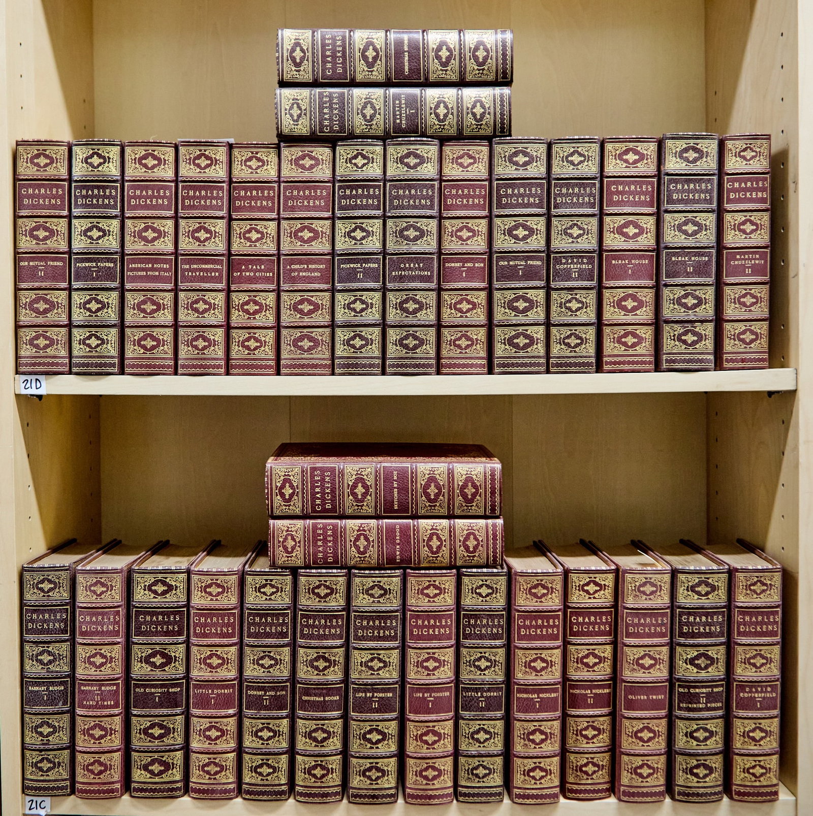 Handsome library set of the works of Dickens: DICKENS, CHARLES The Complete Works. London: Merrill & Baker, 1900. Edition de Grande Luxe, number 153 of 500 sets. 32 volumes (apparently complete thus), full red morocco gilt à la dentelle,