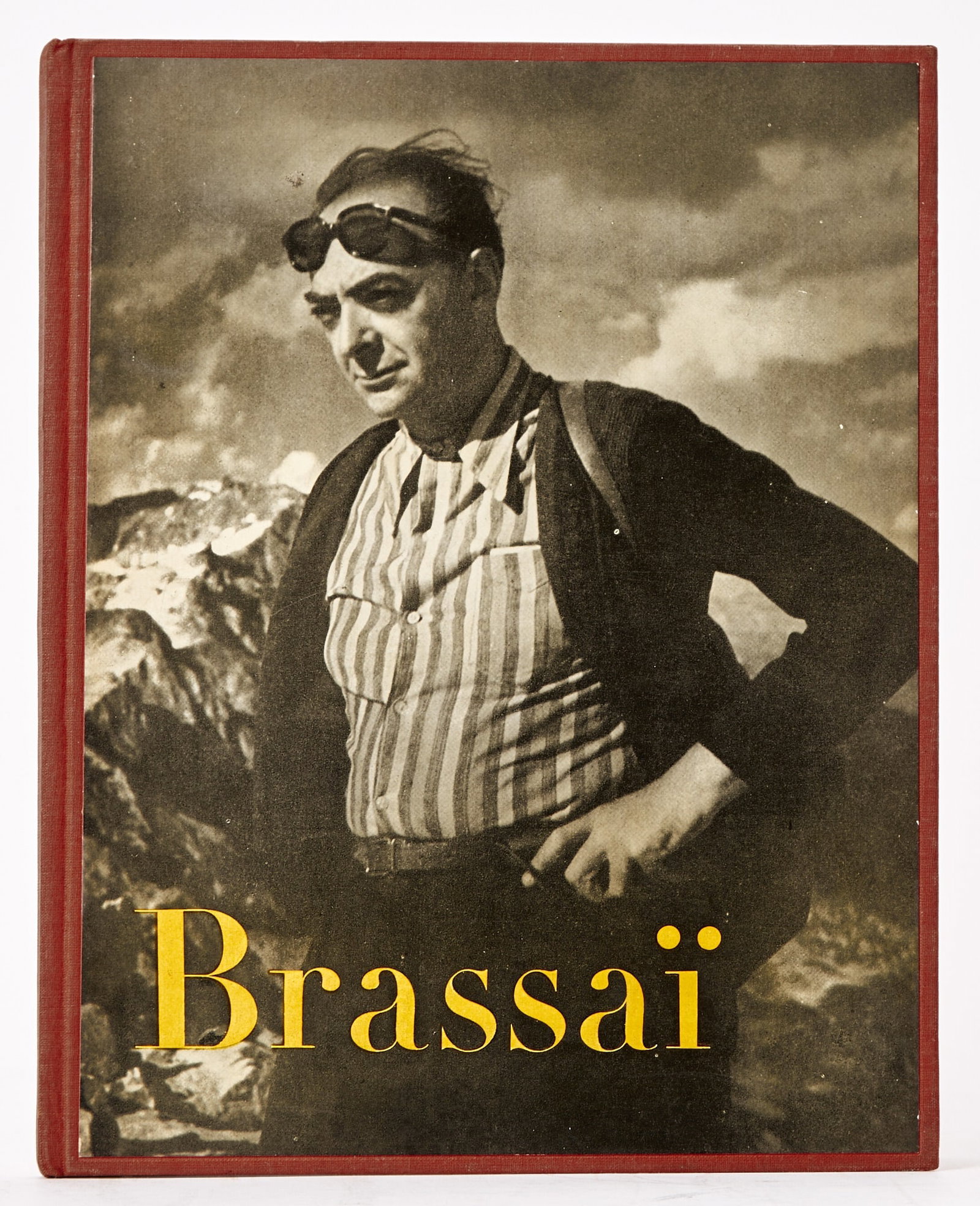 Inscribed by Brassai and with two signed photographs laid-in: BRASSAÏ=[GYULA HALÁSZ] Brassaï. Paris: Editions Neuf, 1952. A presentation copy from Brassaï, inscribed opposite the title for Leo Farland in 1957. Publisher's red cloth with print