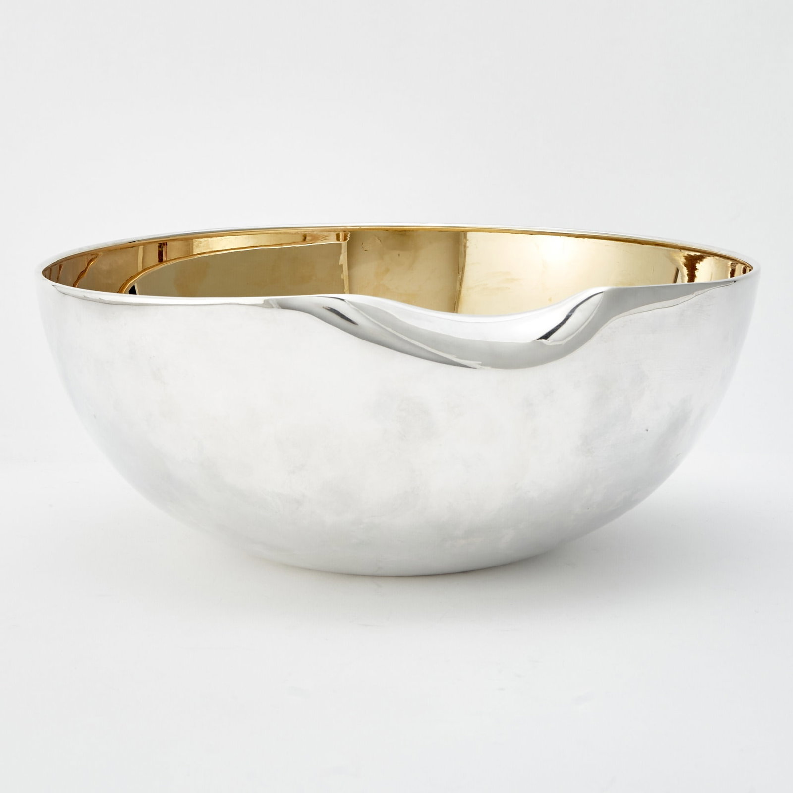 Elsa Peretti for Tiffany & Co. Sterling Silver "Thumbprint" Bowl: Late 20th century Height 4 1/2 inches, diameter 11 inches, approximately 32 ounces. Generally good condition overall
