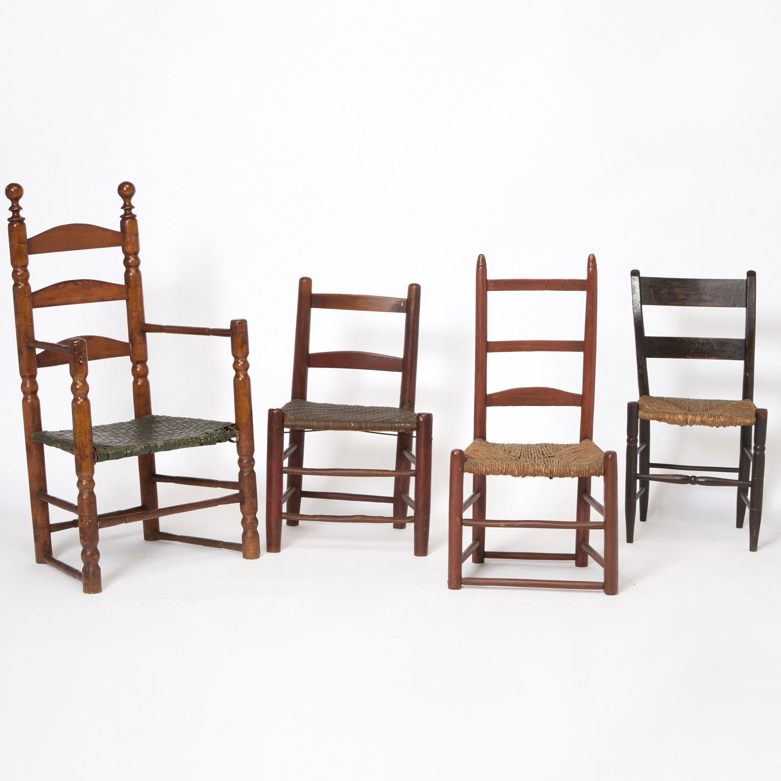 Cherry Slat-Back Armchair: Circa 1750Height 44 inches, width 24 1/2 inches, height of seat 16 inches. Together with Three Slat Back Side Chairs, 19th century; height of largest 37 inches, width 18 1/2 inches. armchair with